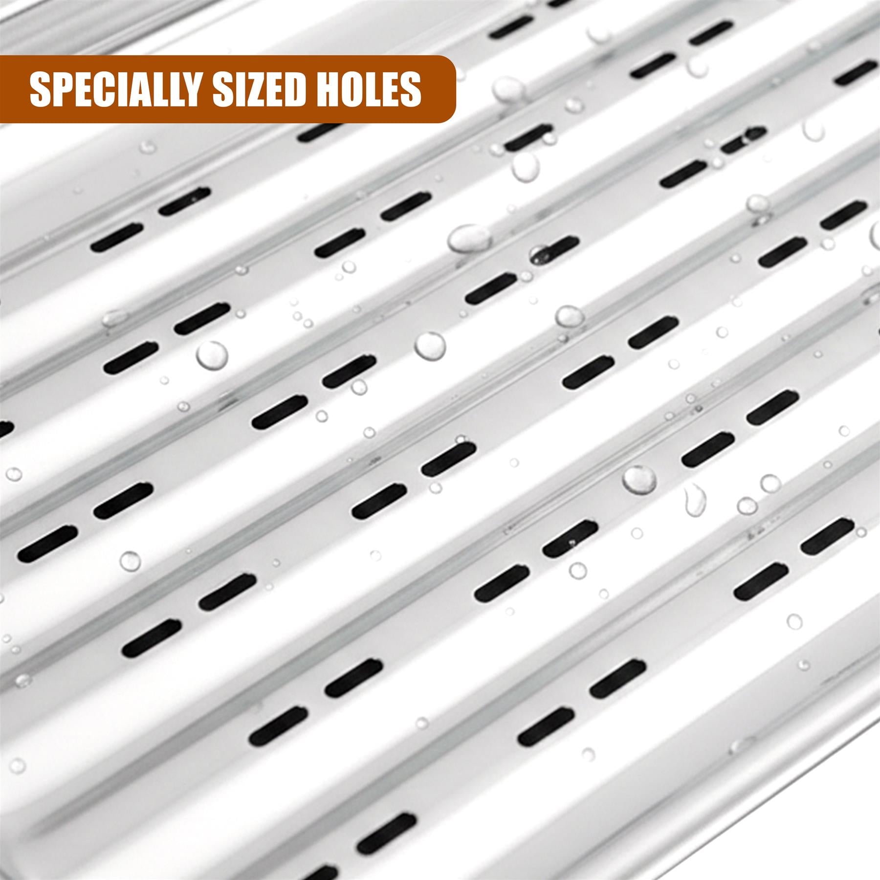 Slotted metal grill tray surface with multiple parallel holes and visible water droplets.