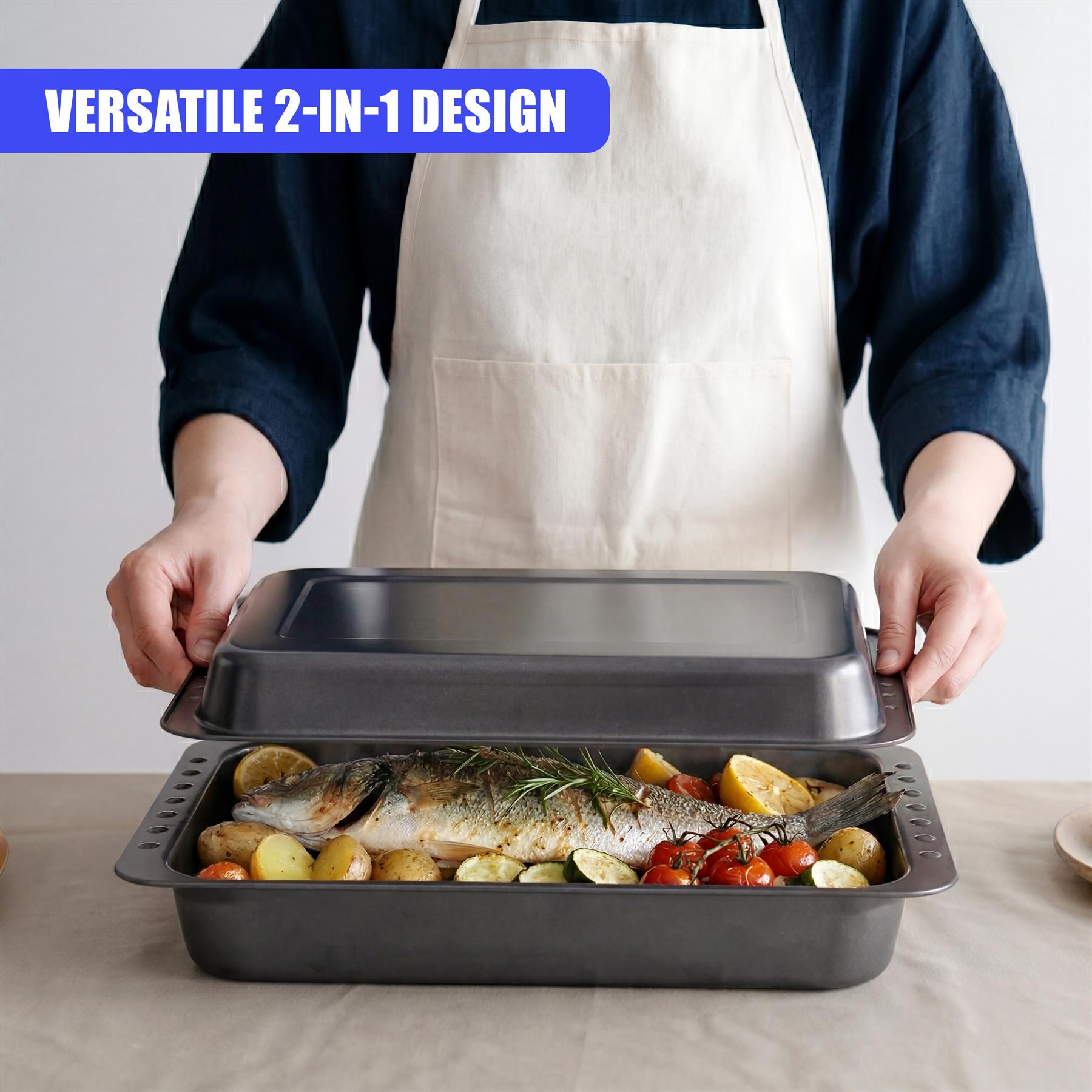 Roasting tin set with a removable insert, containing roasted fish, potatoes, and vegetables.