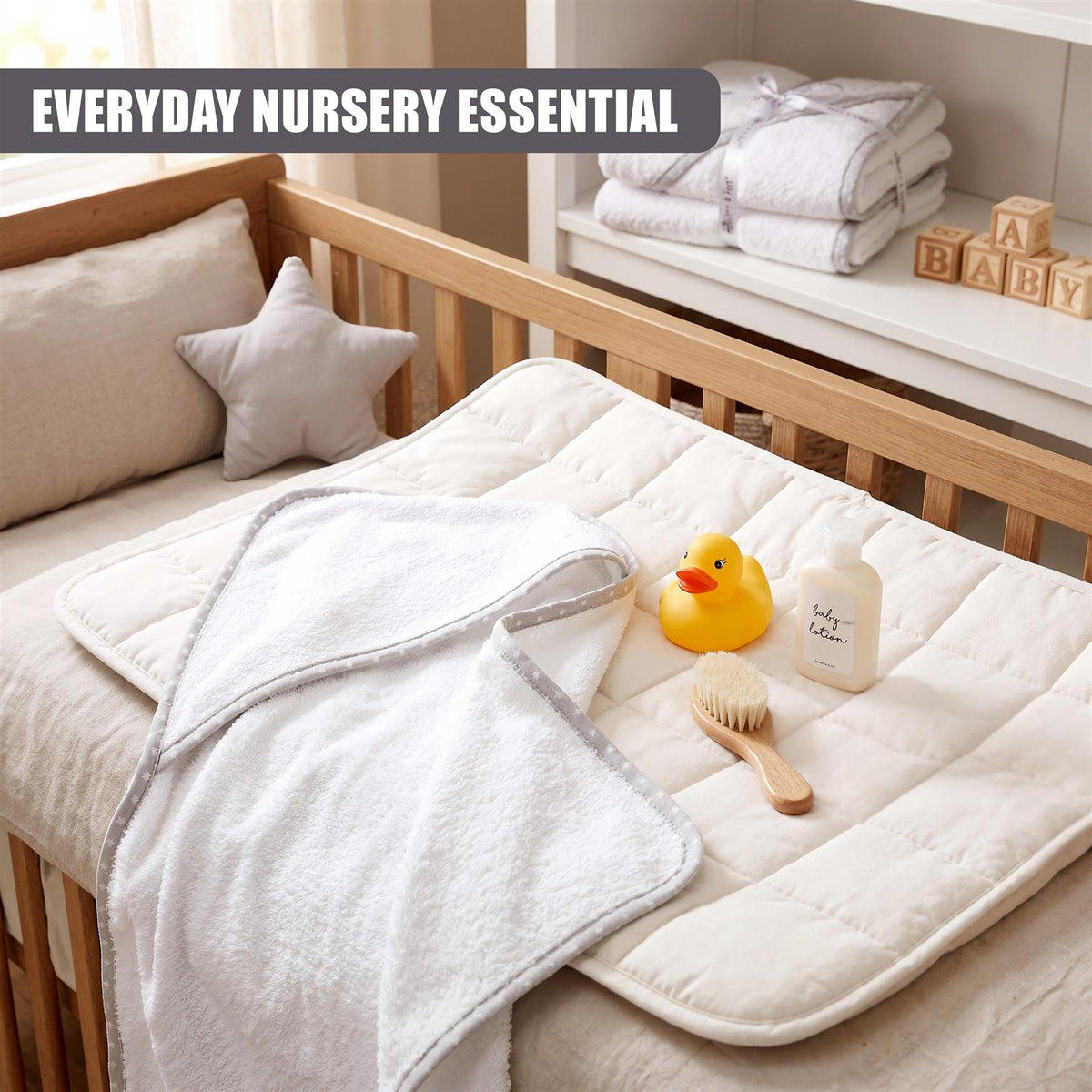 GEEZY pack of 2 hooded baby bath towels on a white crib bedding set