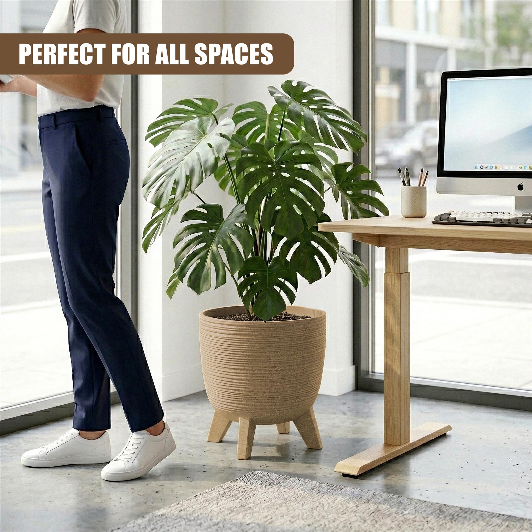 Woven, light brown pot with short wooden legs displaying a lush indoor plant.