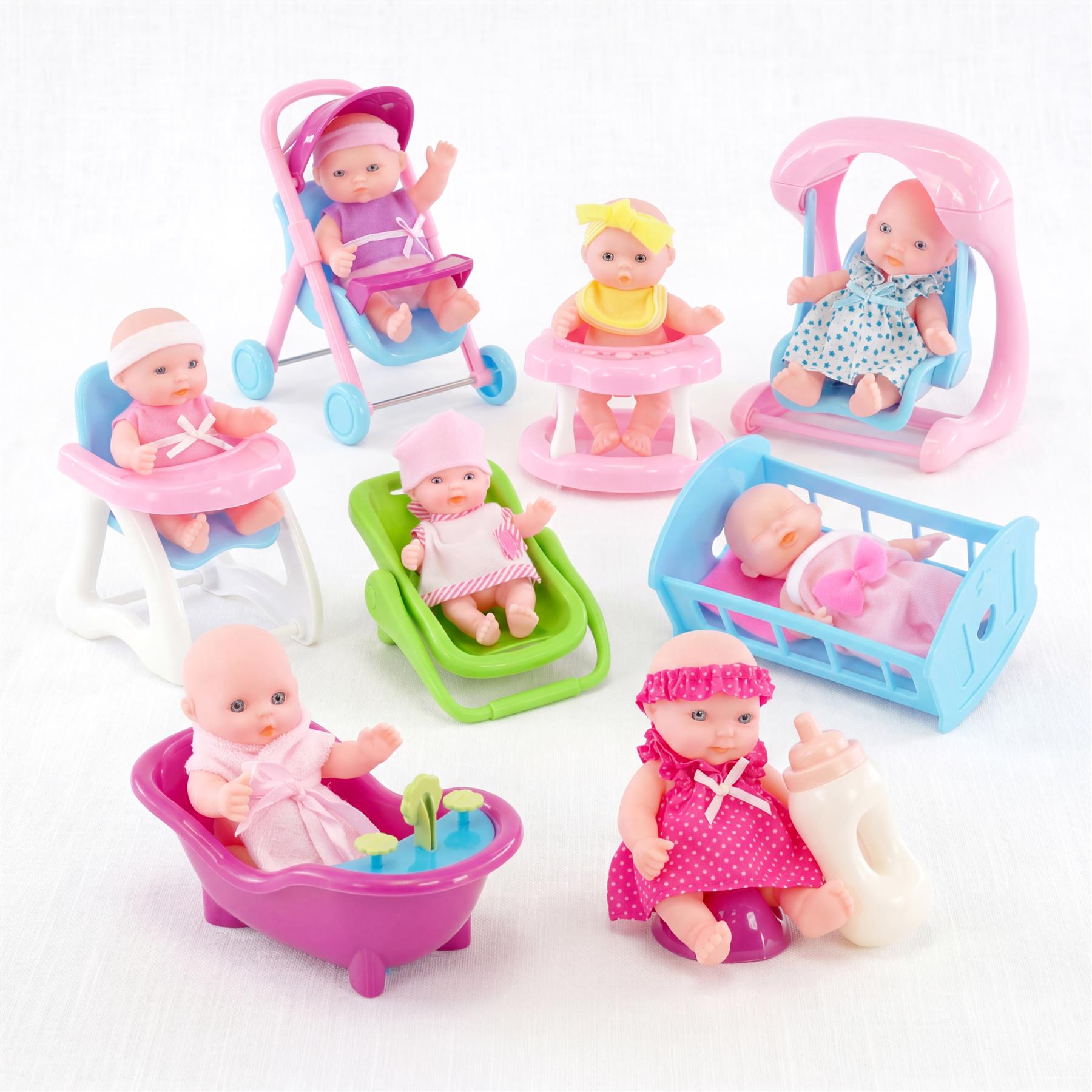 A toy set featuring miniature dolls with outfits, strollers, cribs, and bathing accessories.