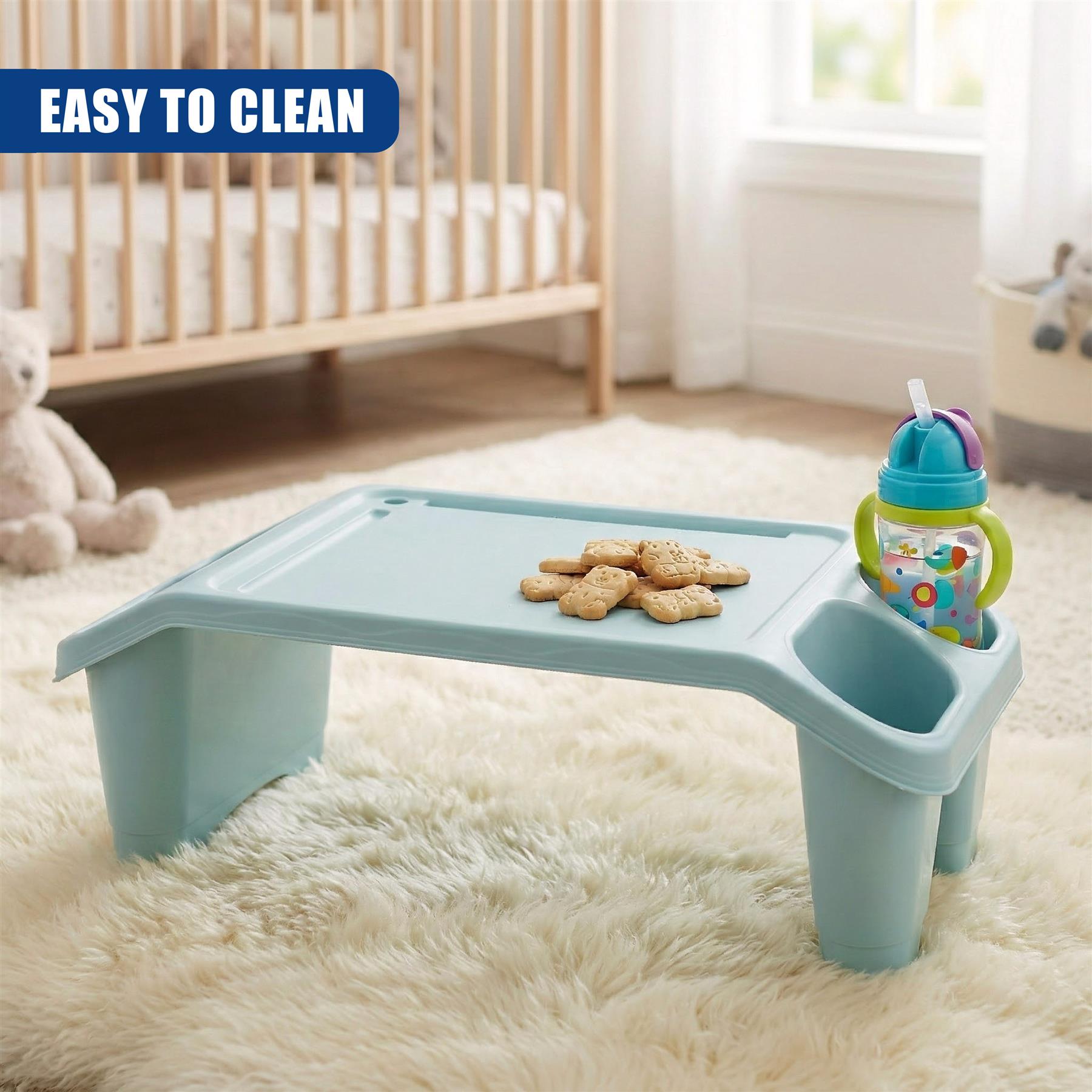 A blue, foldable, and portable table for kids, designed to keep them safe and clean while eating or playing. It has a built-in cup holder and storage compartment. The table is easy to clean and features a non-slip base for stability. - The Magic Toy Shop