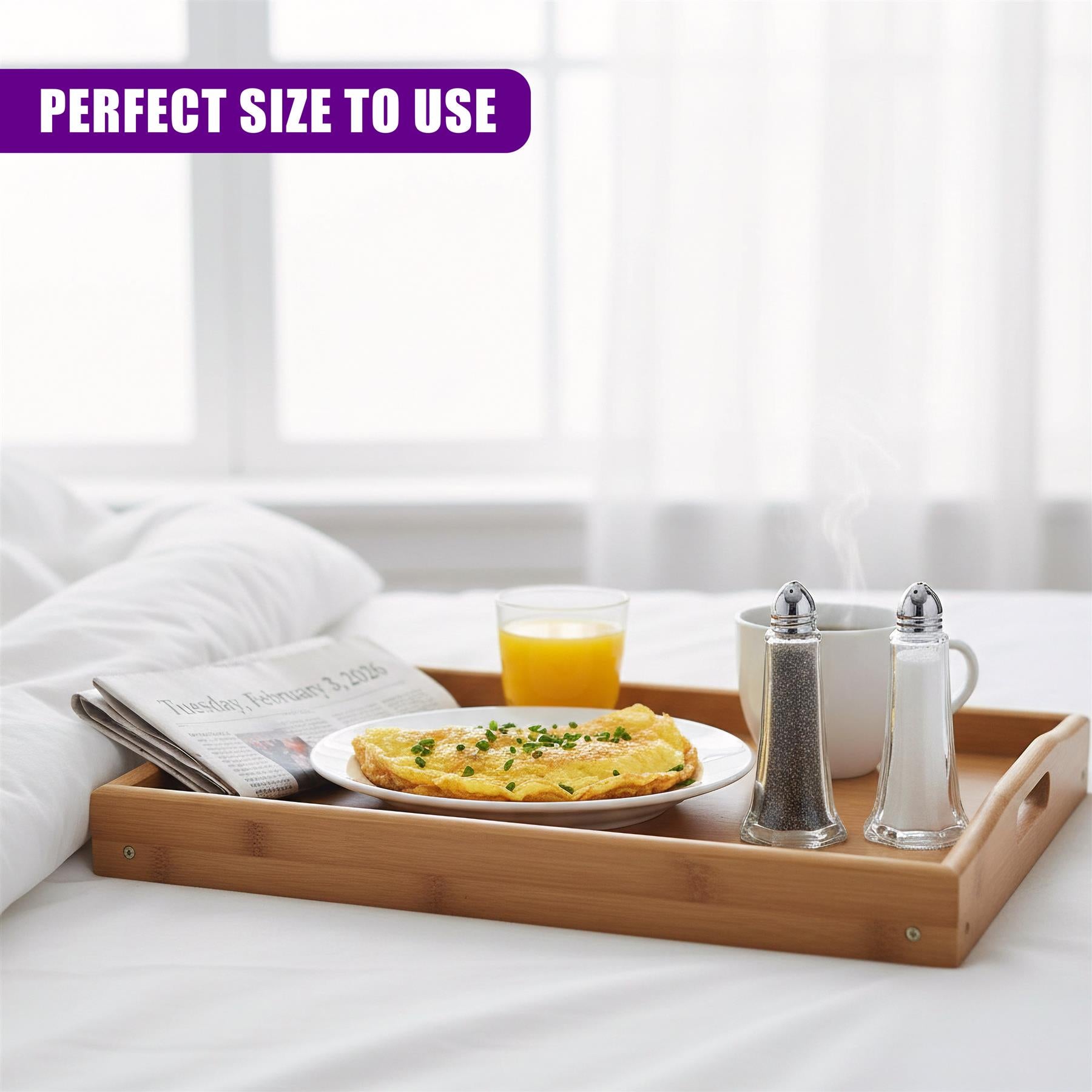 Salt and pepper shakers stand on a wooden tray next to breakfast beverages and food.