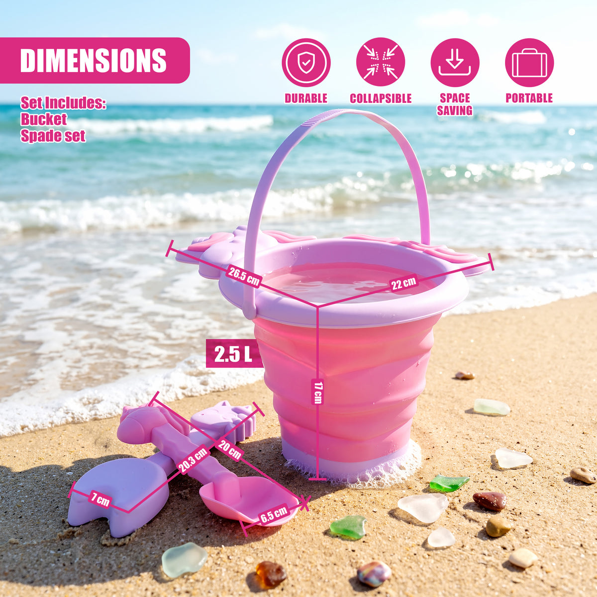 Pink bucket and spade set lies on a sandy beach beside the sea