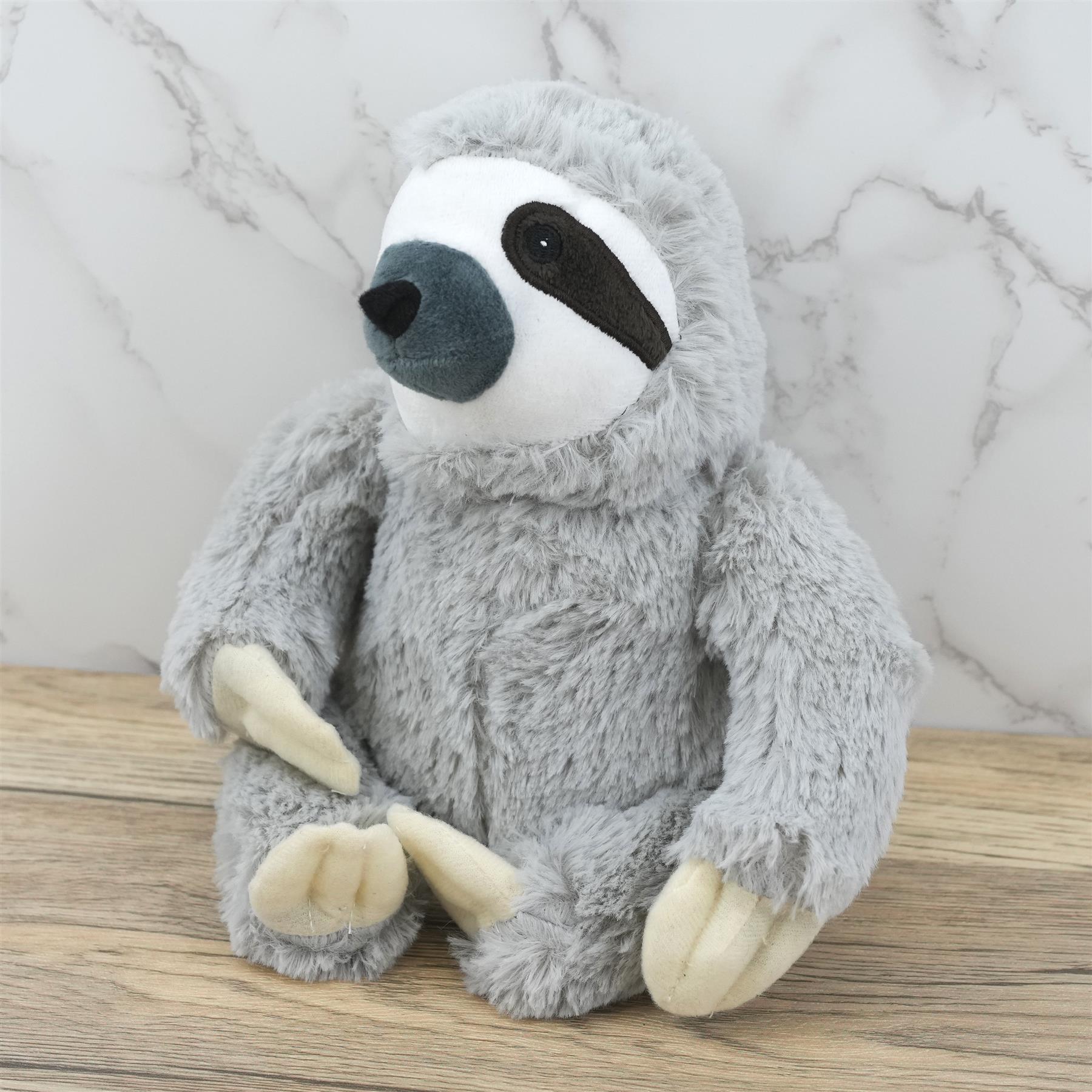 A plush, grey, 10-inch tall, cuddly sloth toy with soft, grey fur and a sweet, innocent face. It has big, black, button-like eyes and a small, black nose. The sloth has four, cream-colored, soft, paws. The toy is made of soft, grey, fuzzy, plush material. - The Magic Toy Shop
