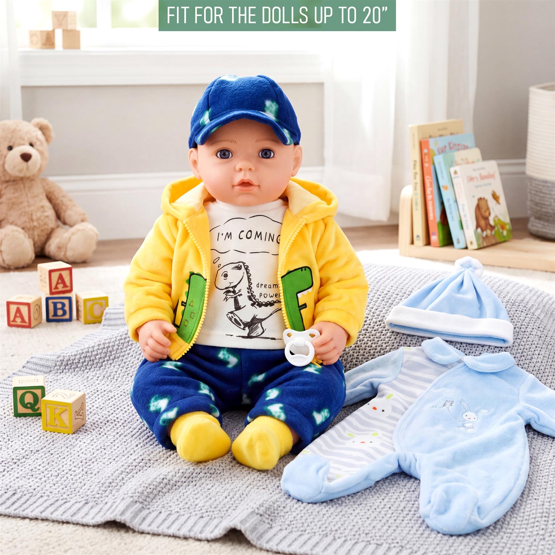Display includes yellow jacket, t-shirt, and blue accessory set for dolls up to 20 inches.