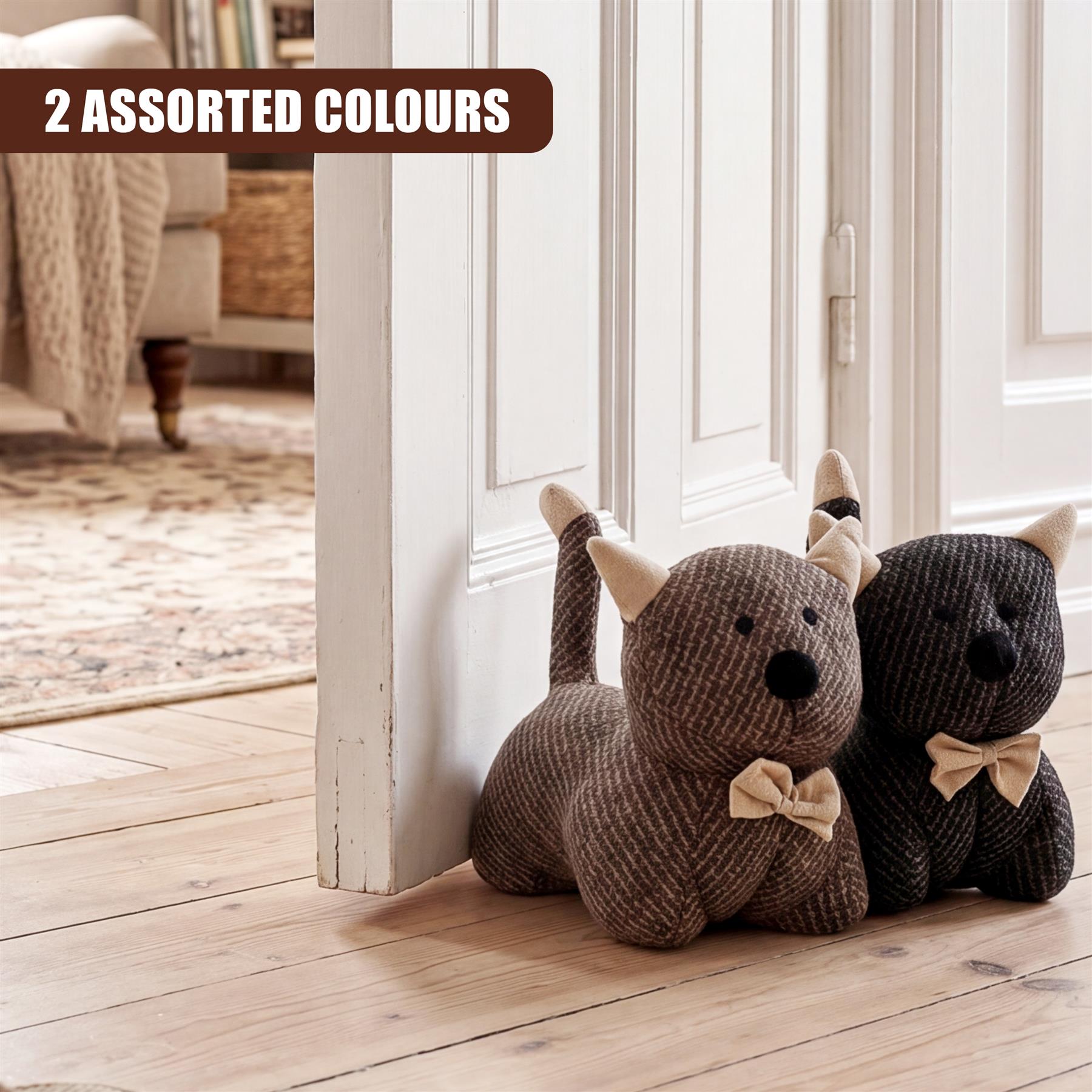 Three stuffed animal door stoppers—fawn, dog, and bear—are placed on a light wooden floor.