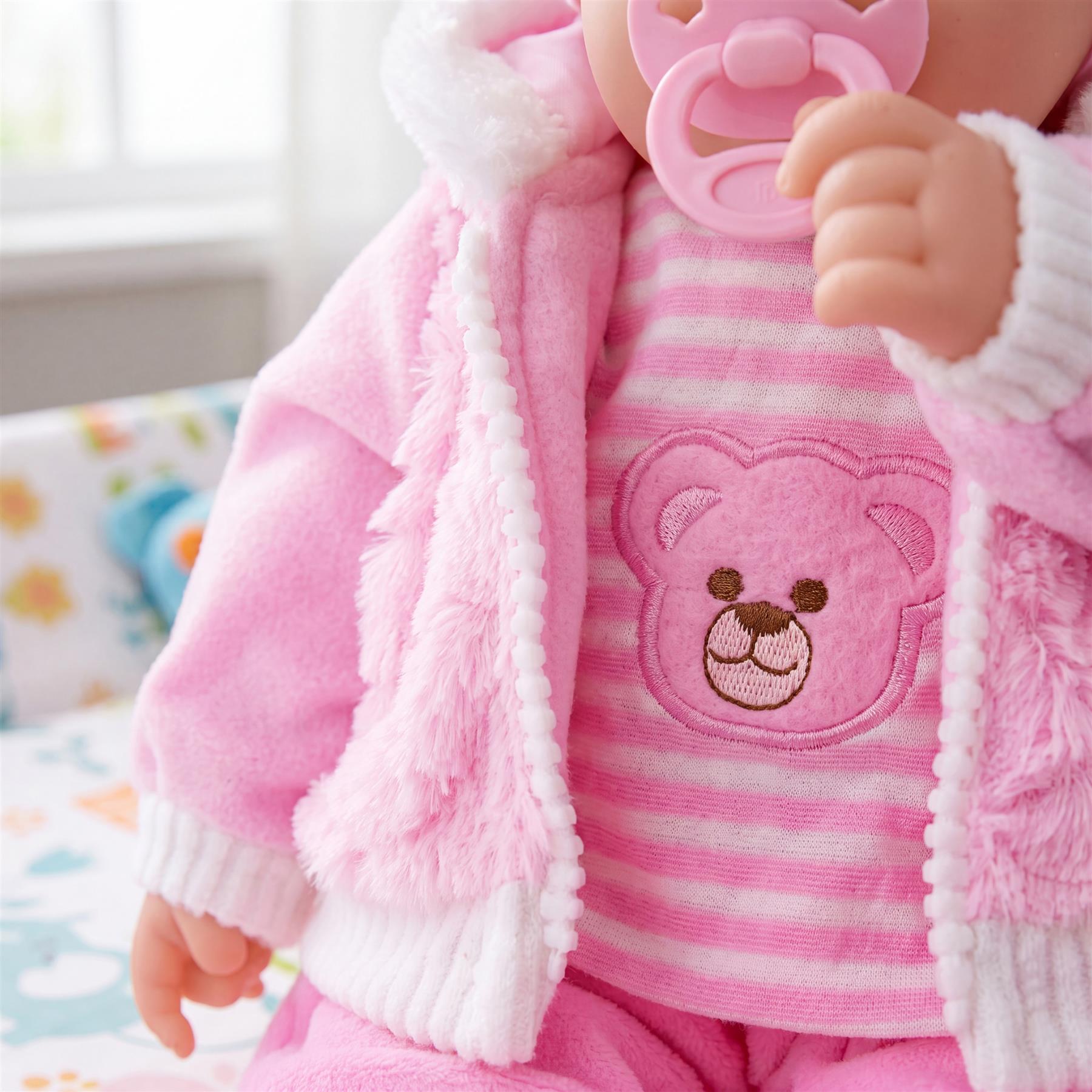 Pink plush baby doll, labeled Pinky, stands approximately 50 centimeters tall with fabric clothing accents.