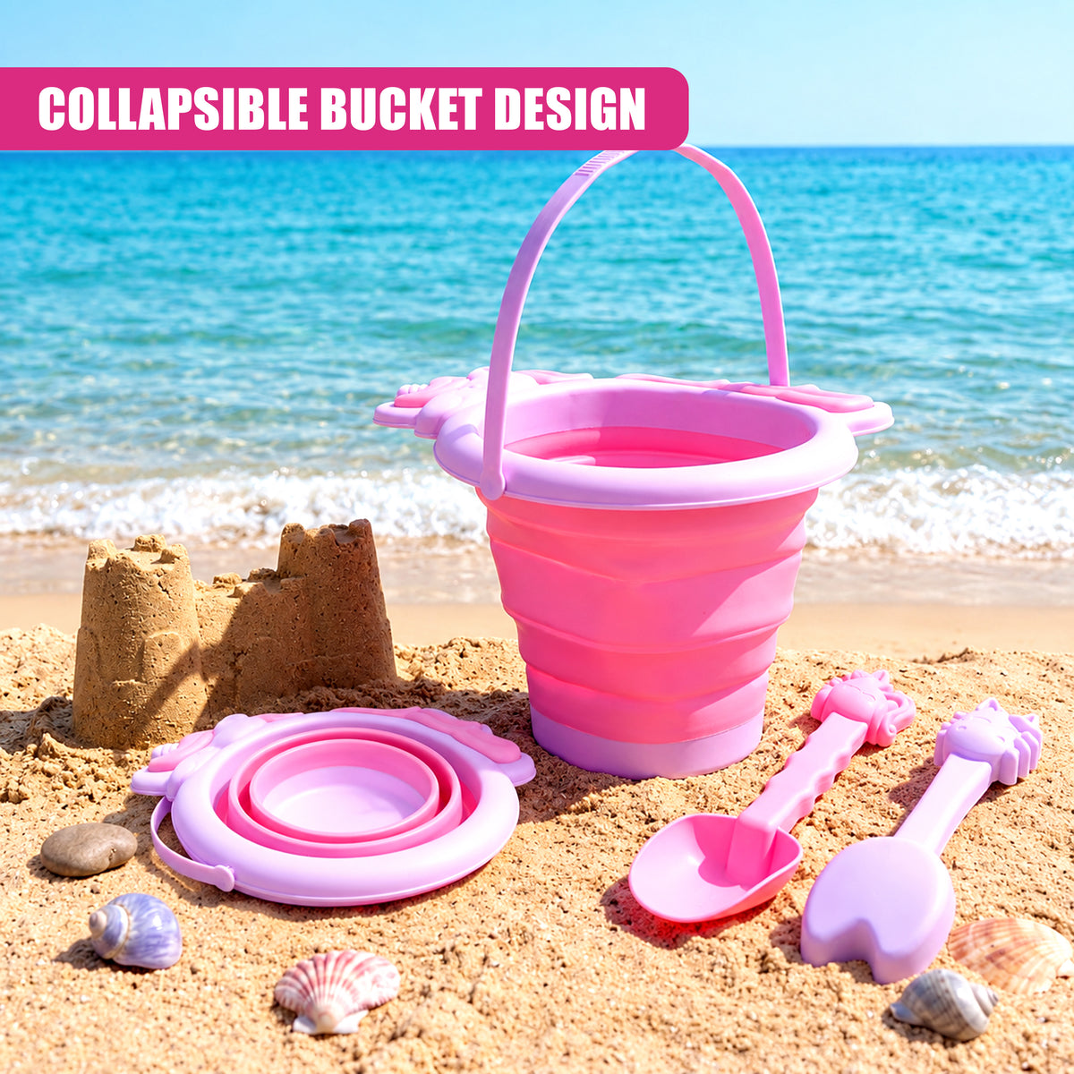 Pink collapsible beach bucket and spade set on a sandy beach with a blue sea in the background