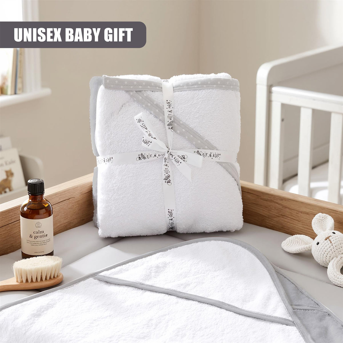 Pack of 2 GEEZY hooded baby bath towels, wrapped in white with grey detailing, presented as a gift