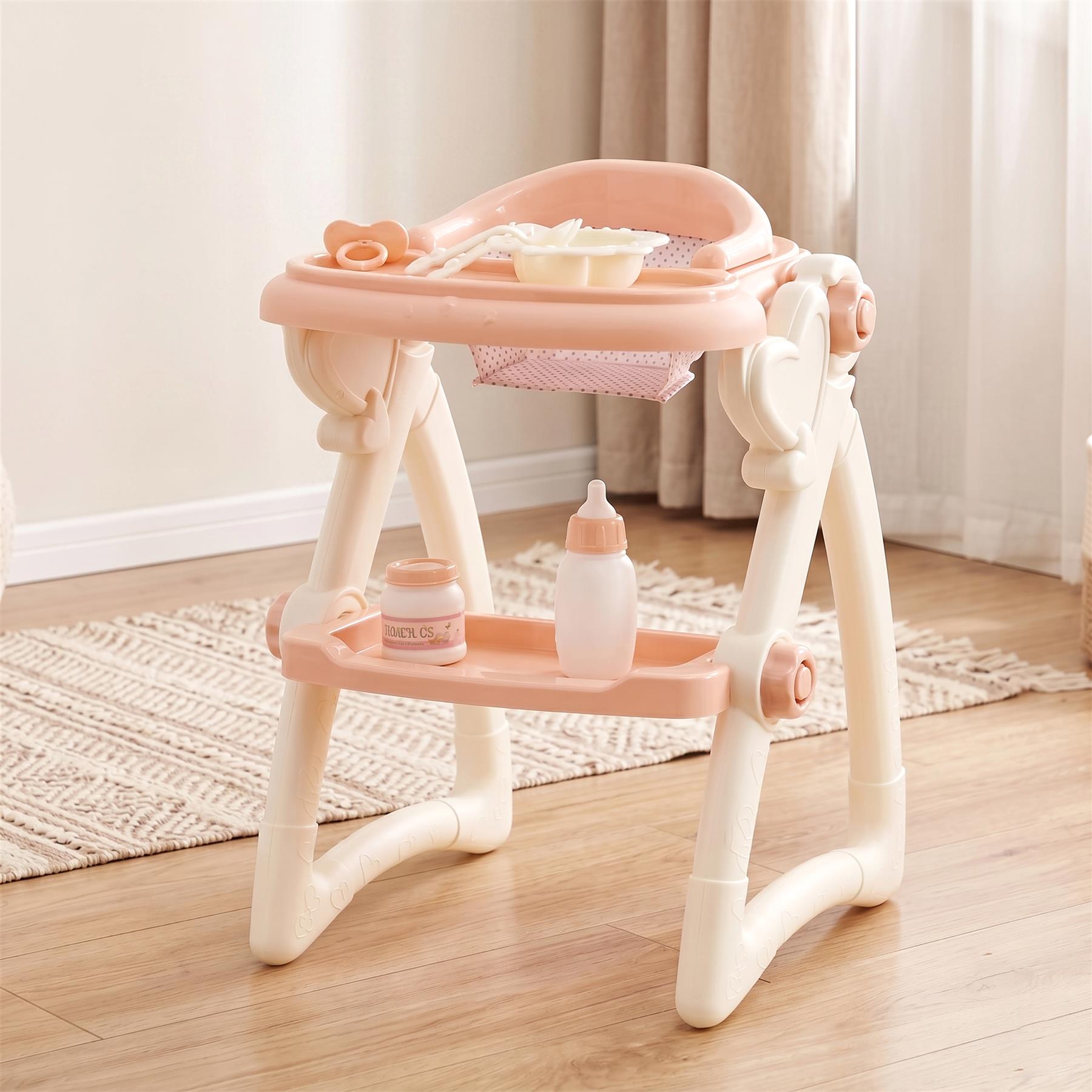 Light pink plastic doll high chair toy with a feeding tray, shelf, and various simulated accessories.