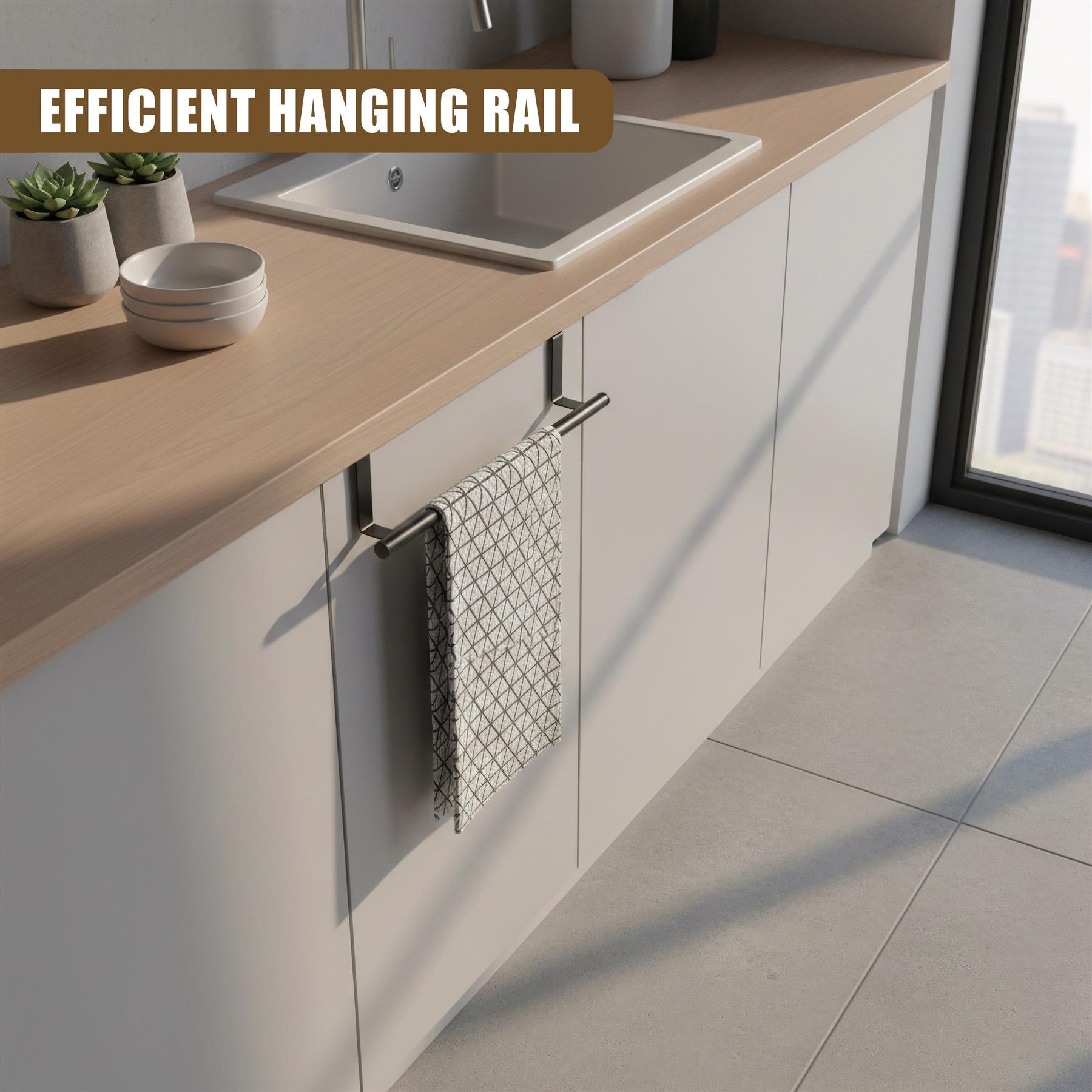 Stainless steel towel rail attached beneath a light wood cabinet, holding a patterned, hanging kitchen towel.