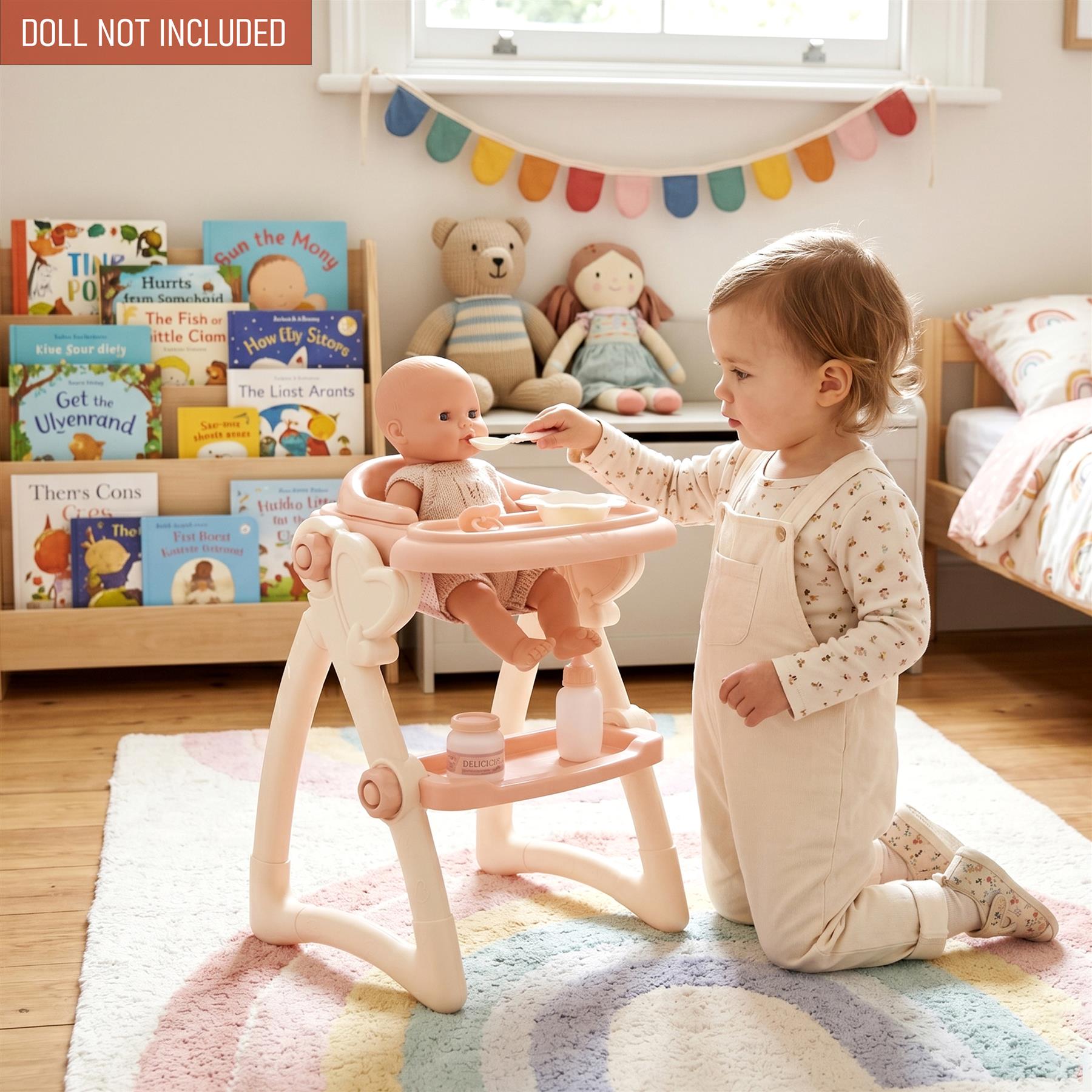 Child interacts with a doll seated in a pink, adjustable doll high chair and feeding accessories.