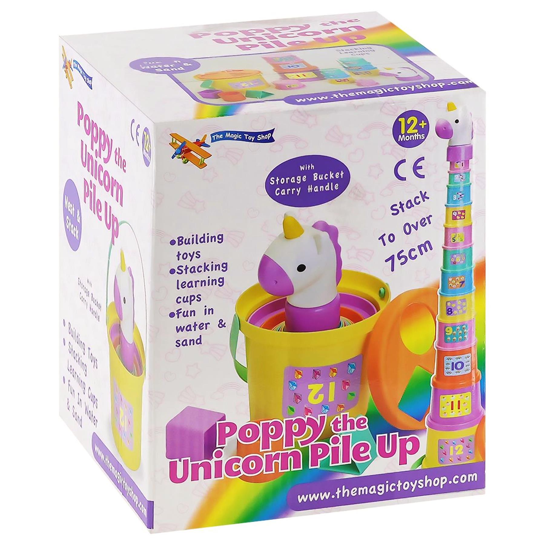 Stacking toy set visible inside the box, featuring a unicorn figurine and yellow storage bucket.
