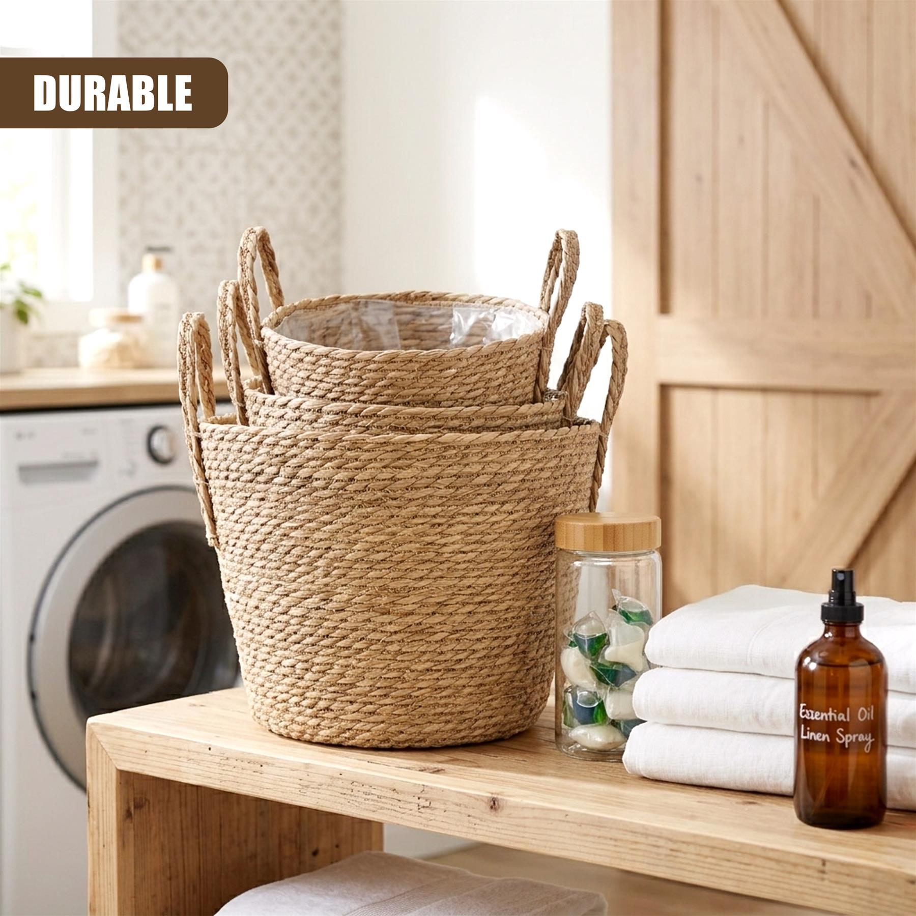 Stacked set of three woven wicker baskets with handles on a wooden surface.