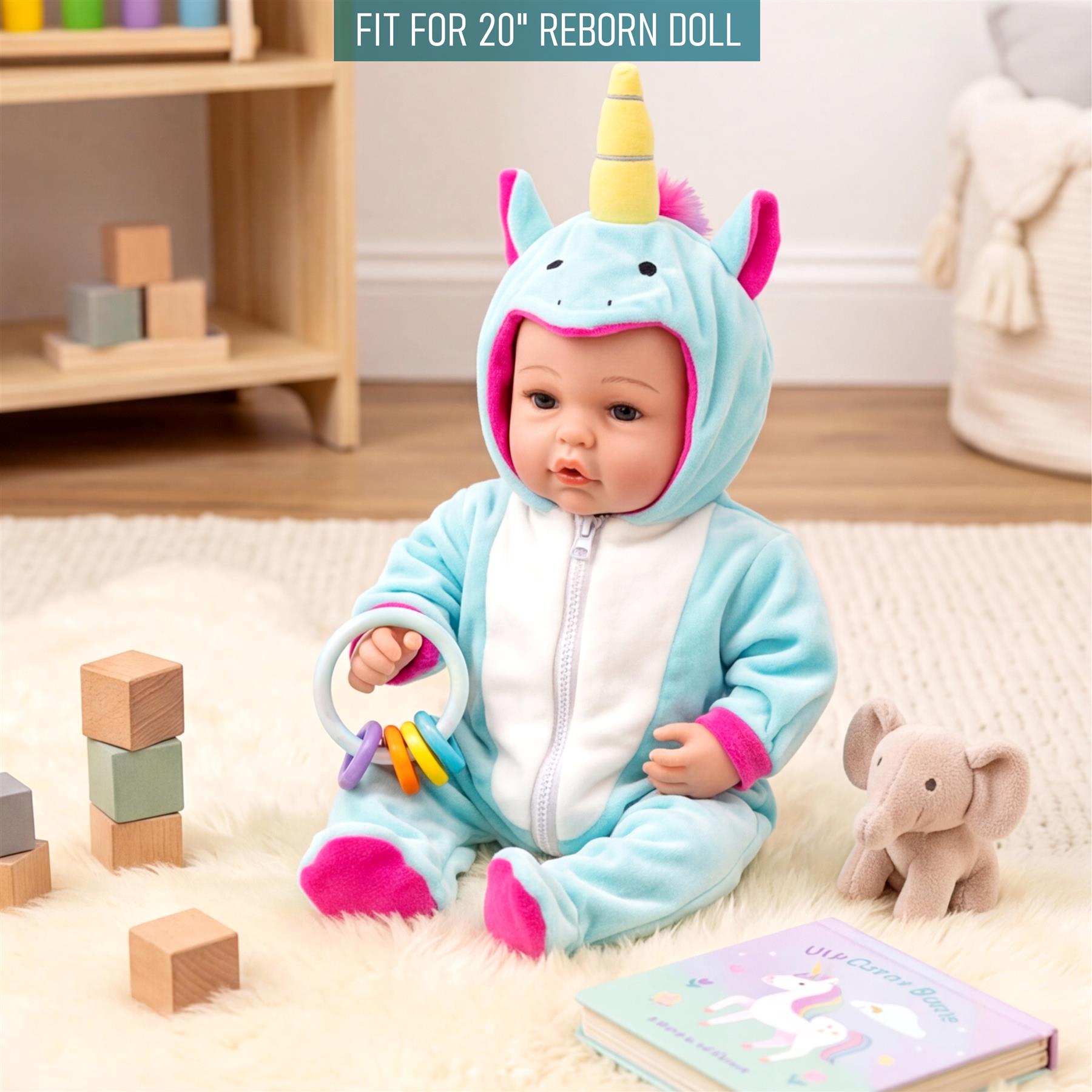 Doll wearing a blue unicorn costume sits on a rug among wooden blocks, a plush elephant, and a book.