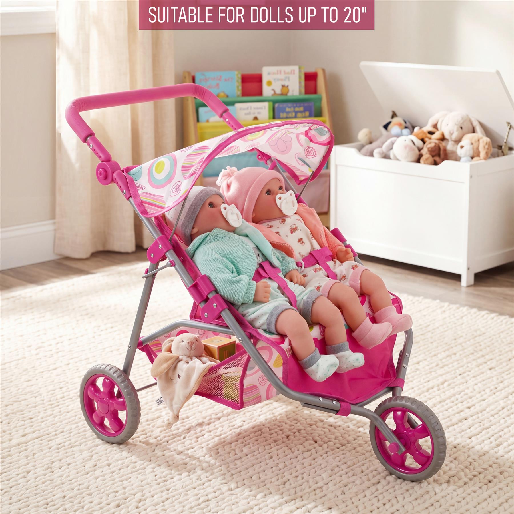 Pink twin doll's pushchair featuring a curved handle and three operational wheels for play.