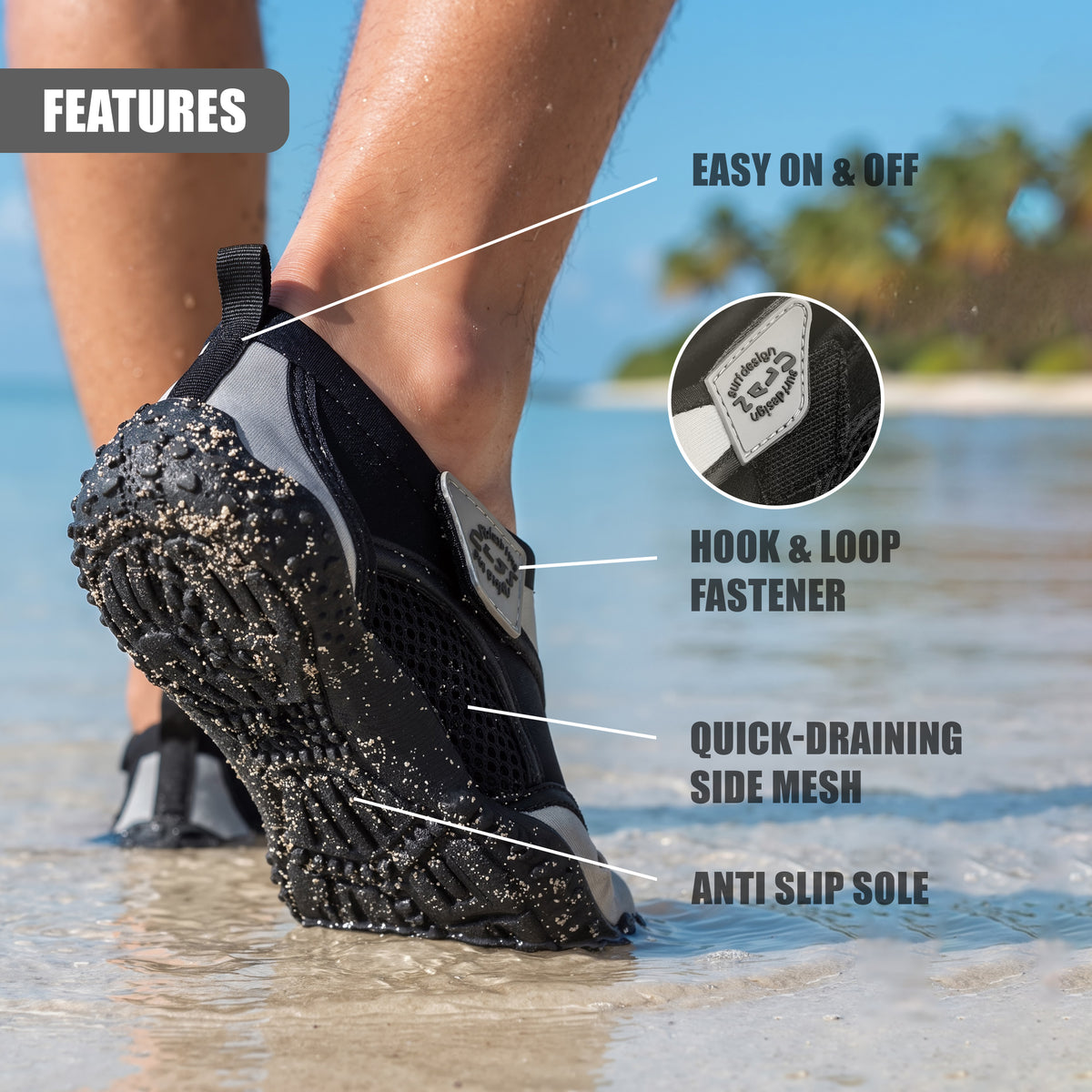 Grey GEEZY aqua shoes with a hook and loop fastener, shown on a foot in a seaside setting