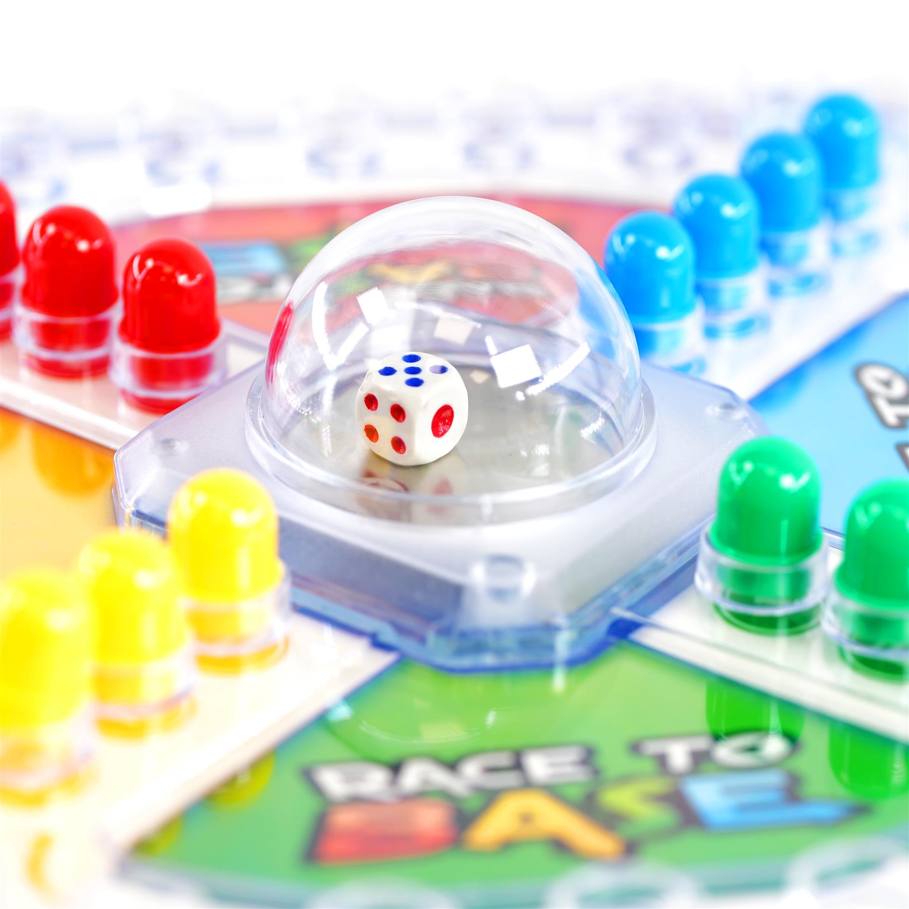 White dice rests in clear dome, next to race game components and track.