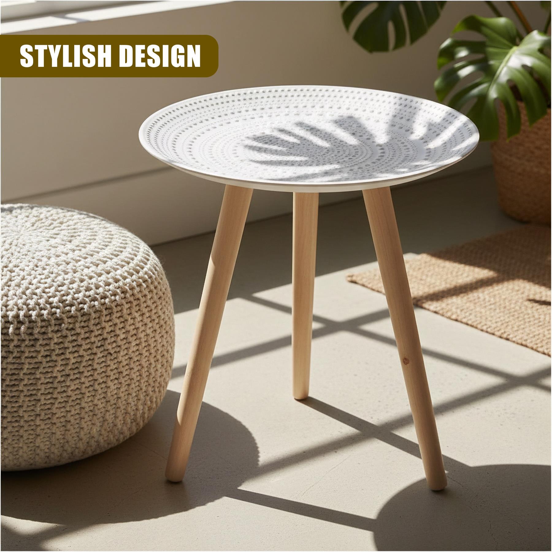 Round white side table with three wooden legs and a radial pattern on the surface.