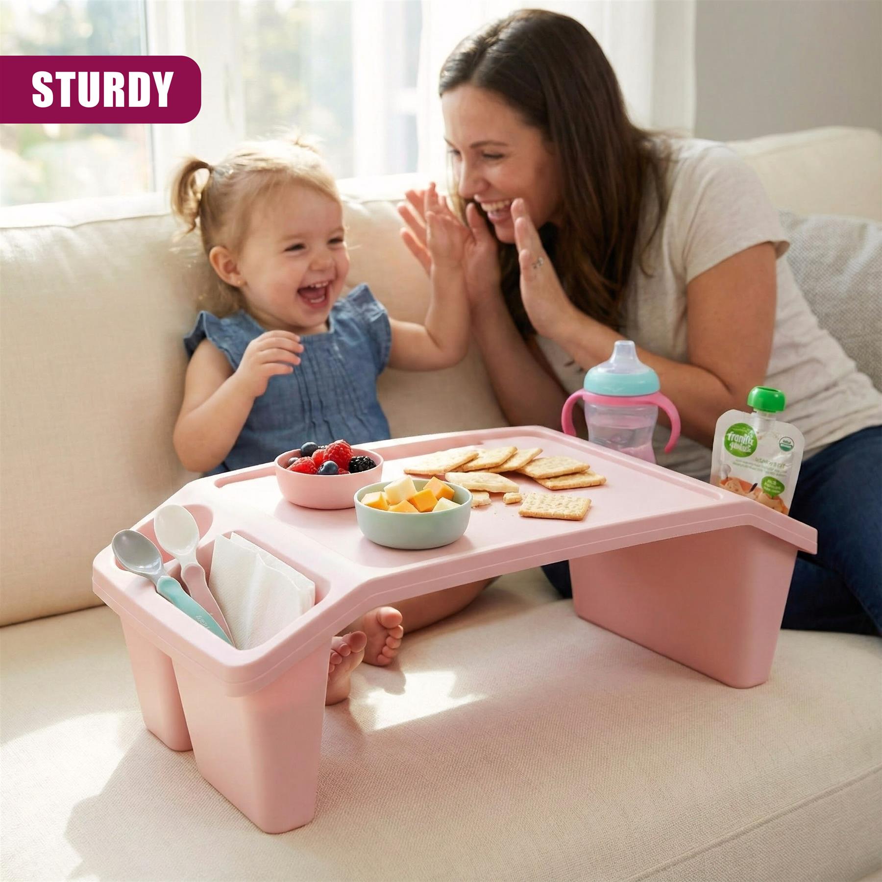 A pink, compact, and sturdy table for kids, featuring a built-in storage container, a tray for snacks, and a cup holder, ideal for mealtime or playtime on-the-go. - The Magic Toy Shop