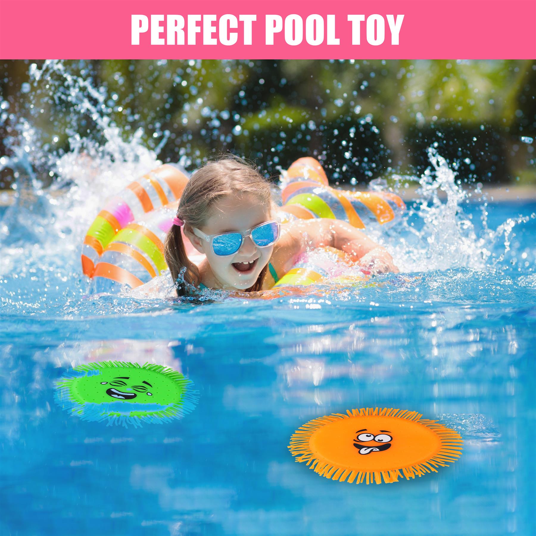 A child playing in a pool with two floating toys.