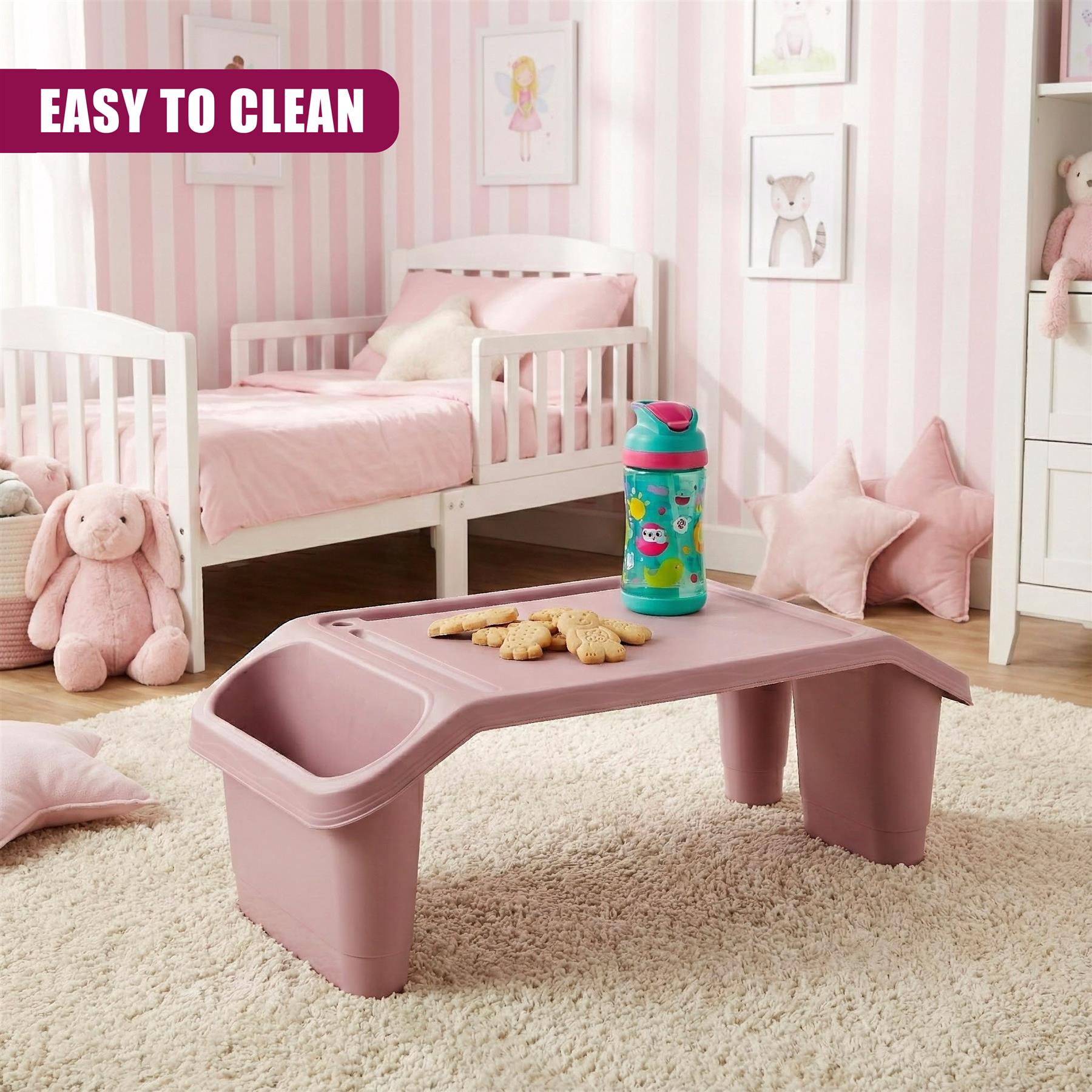 A pink, rectangular table with a built-in storage bin, featuring a water bottle and cookies on its surface, in a child's bedroom with a white bed, pink and white striped walls, and a few toys and pillows. - The Magic Toy Shop
