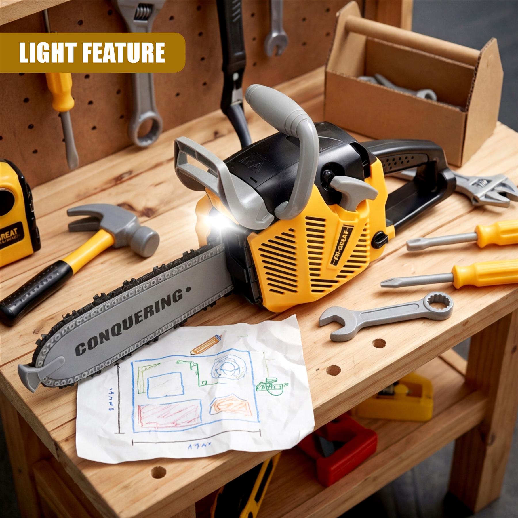 Yellow toy chainsaw, tools, and drawing paper are arranged on a natural wooden tabletop.