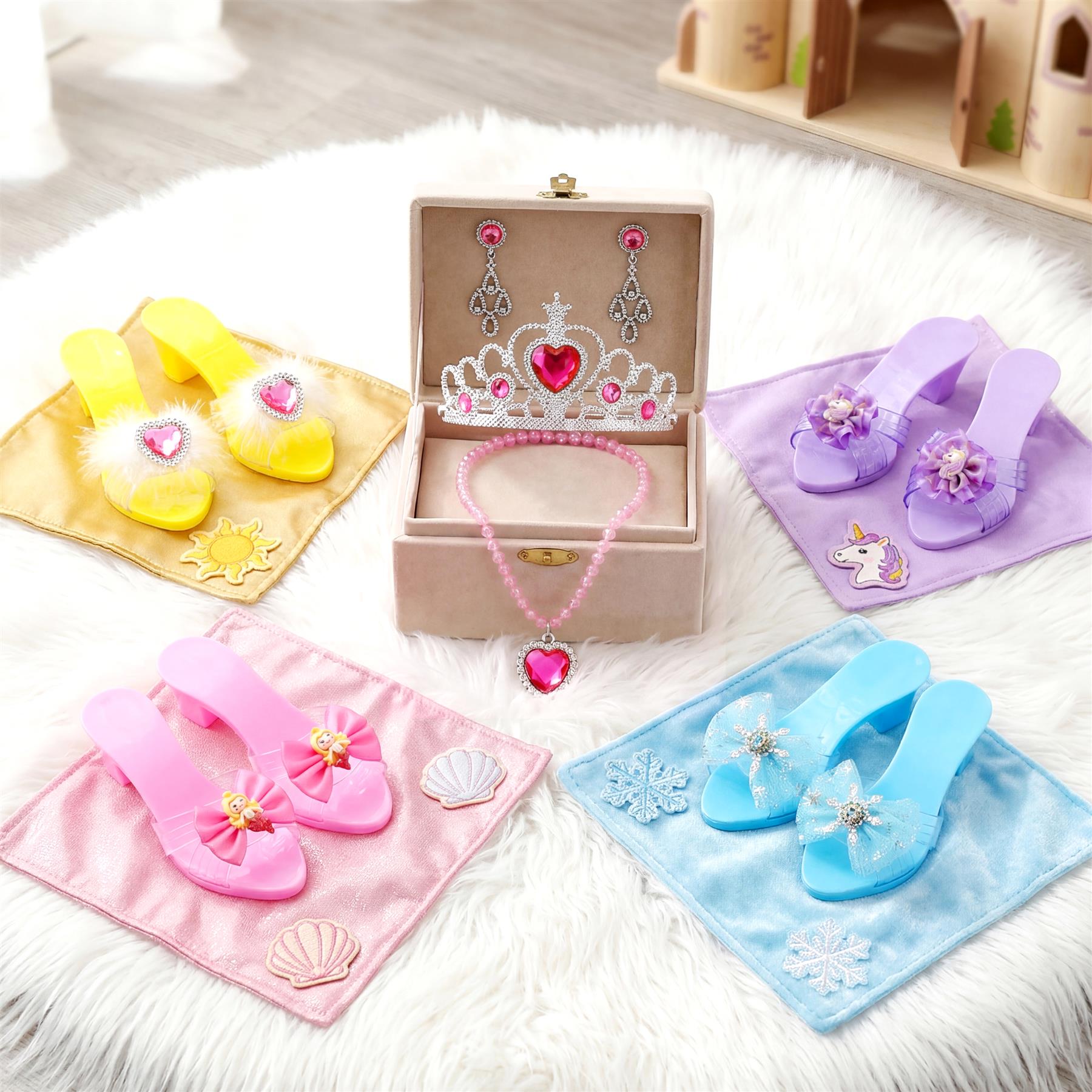 Multiple sets of child play shoes, jewelry accessories, and decorative cloths displayed together.