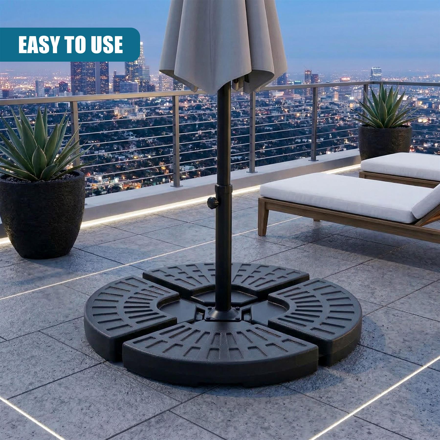 Large black circular patio base with radiating slotted support for a cantilever umbrella.