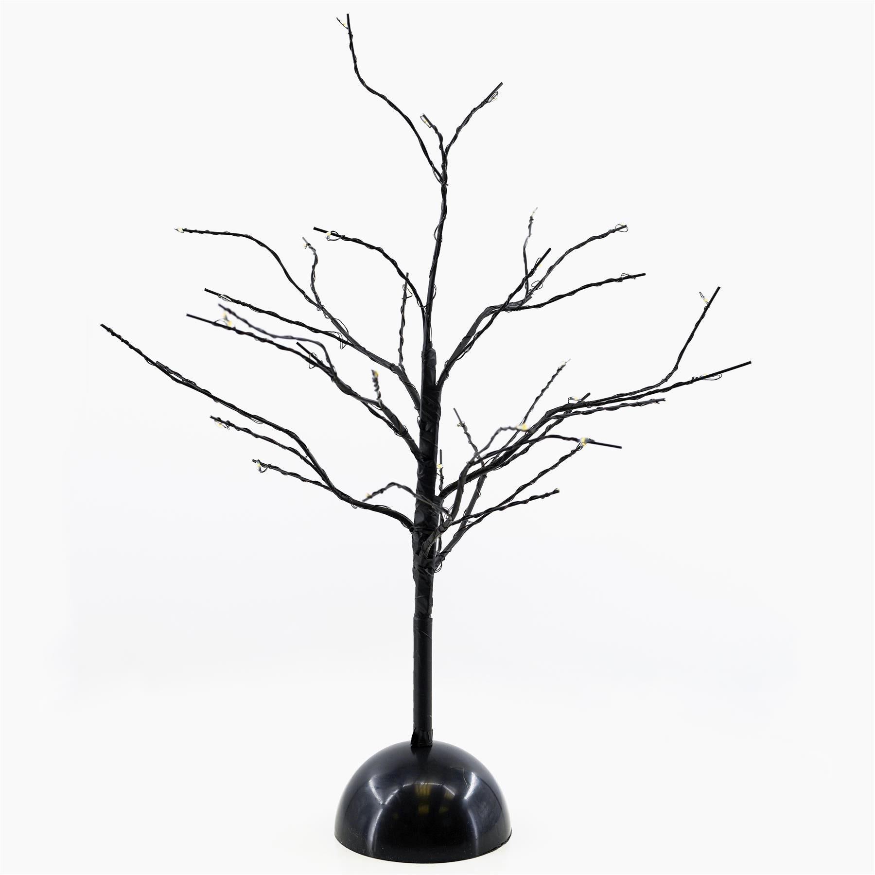 A decorative LED tree lamp with a black trunk and branches, featuring 32 small LED lights. The tree is mounted on a circular black base, designed to provide warm ambient lighting suitable for home decor or festive occasions. Ideal for creating a cozy atmosphere. Available at themagictoyshop.