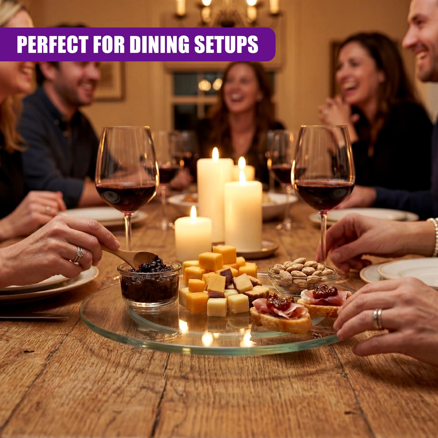 Glass turntable displaying cubed cheese, nuts, dips, and crackers on a wooden dining table.