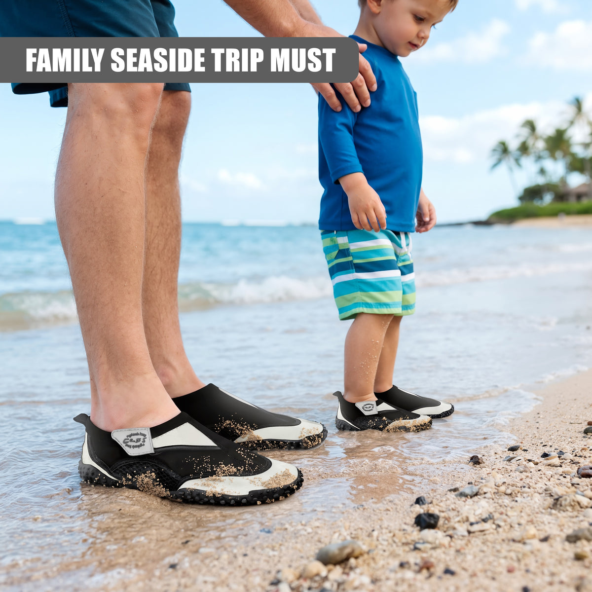 Grey GEEZY aqua shoes for adults and children stand on a beach beside the sea