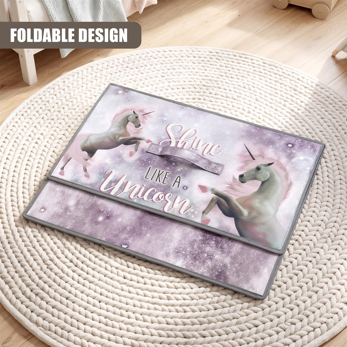 Unicorn storage box with a fold-out design and a sparkly unicorn image on a woven rug