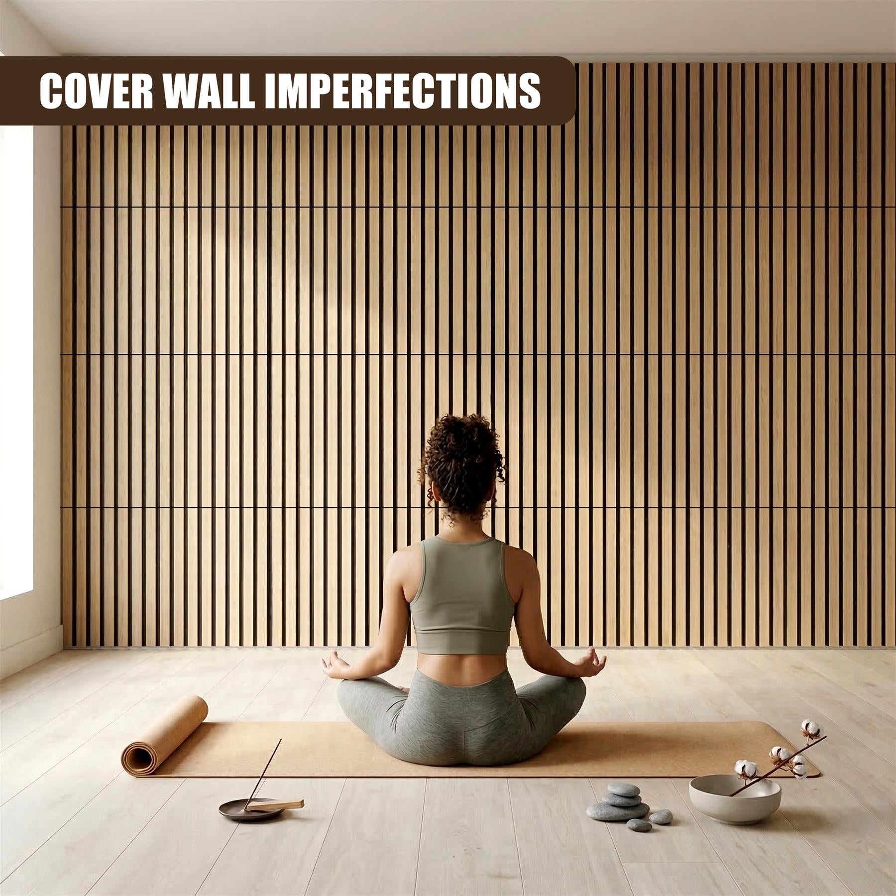 Vertical wooden slat panels cover the wall behind a person seated on a yoga mat.