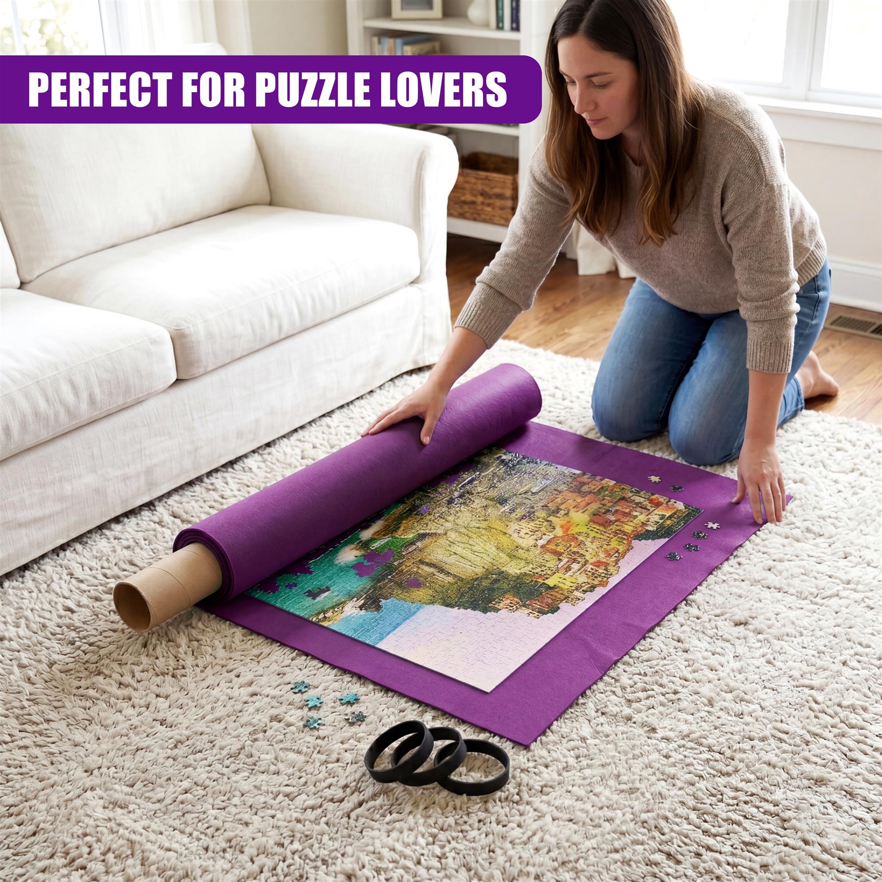A woman spreads a purple roll-up puzzle mat featuring an artwork on a white rug.