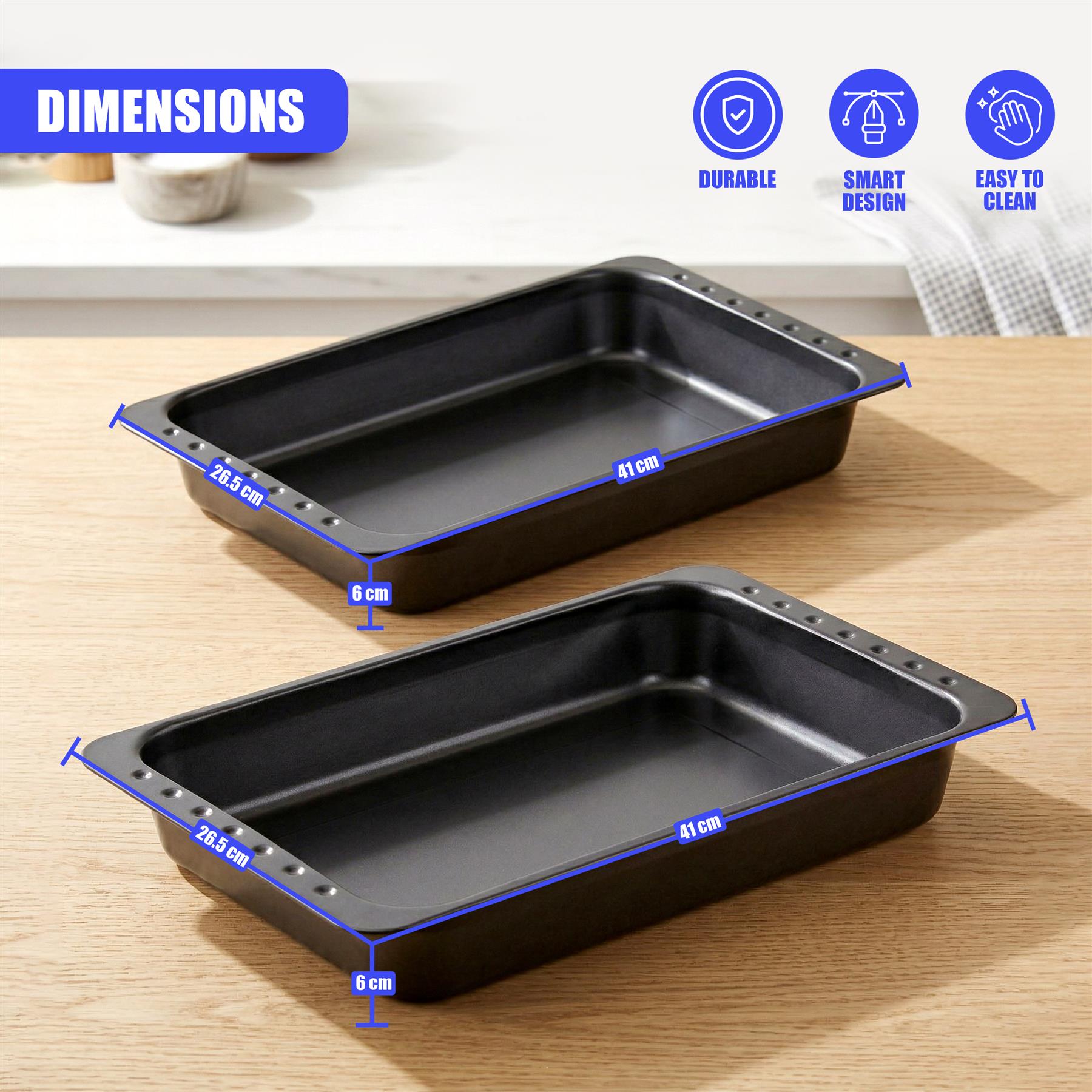 Two black metal roasting trays are displayed on wood, labeled with dimensions of 26.5 cm and 41 cm.