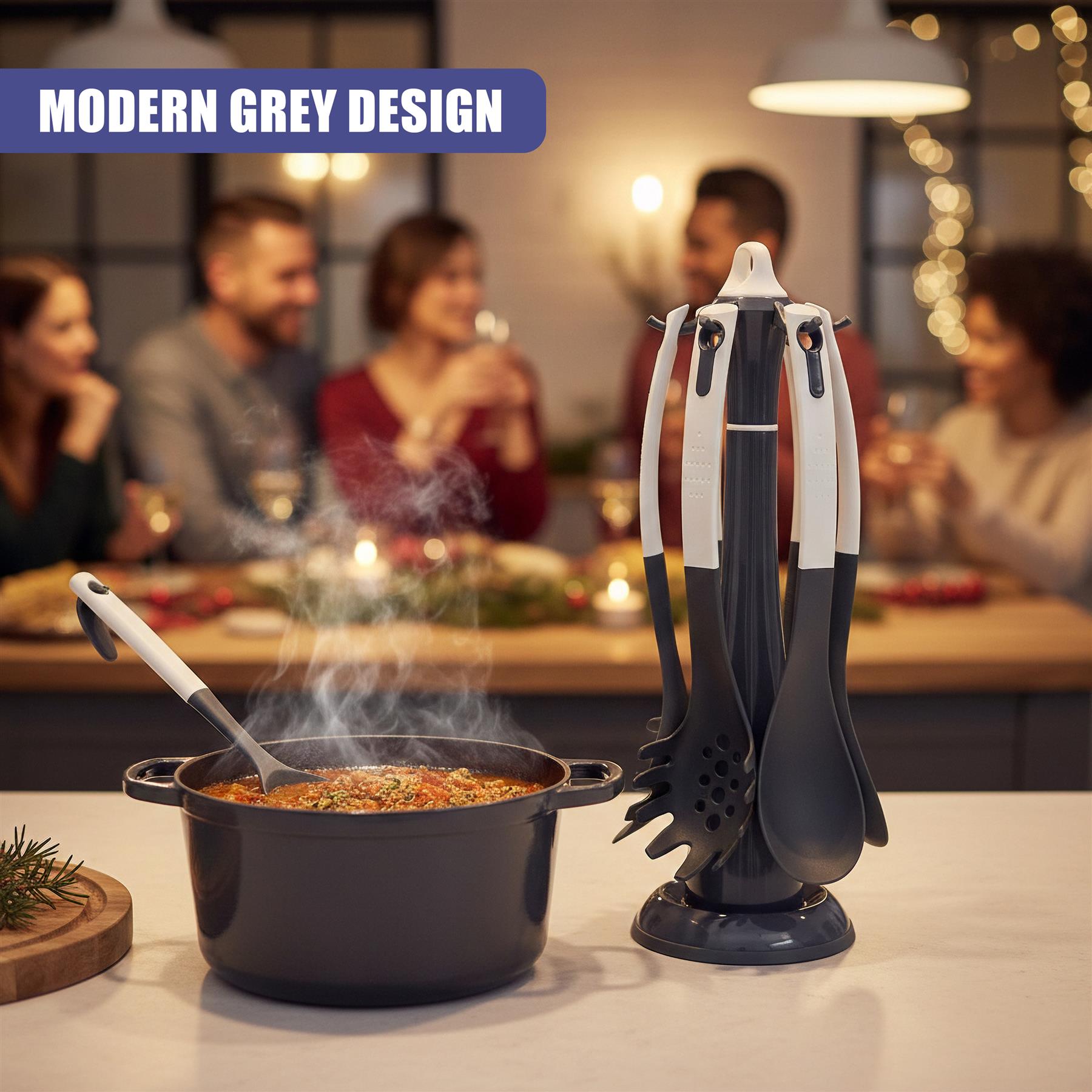 A dark grey pot with steam and a standing collection of matching kitchen utensils.