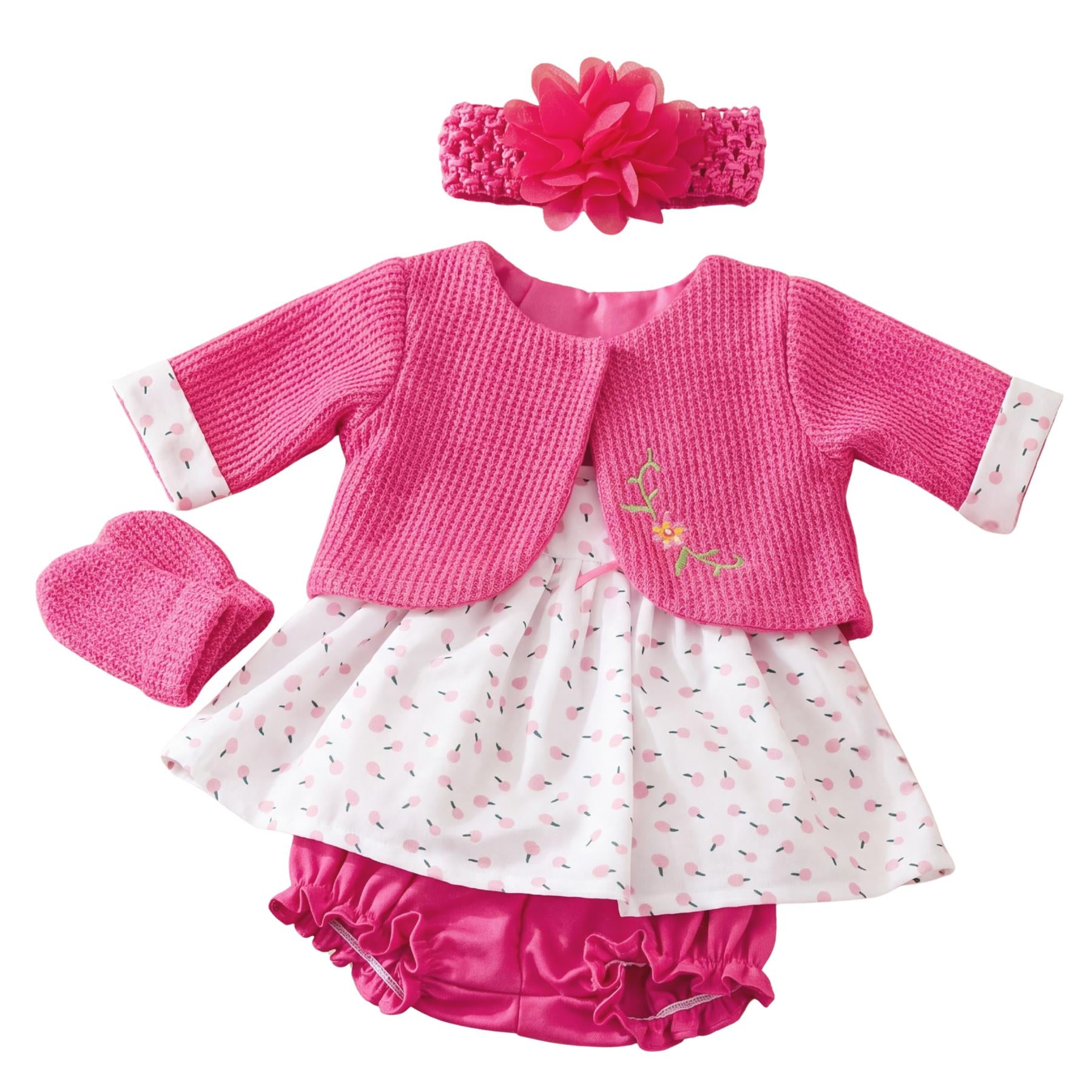 Hot pink doll clothing set including a knitted top, patterned skirt, ruffled bottoms, and bow.