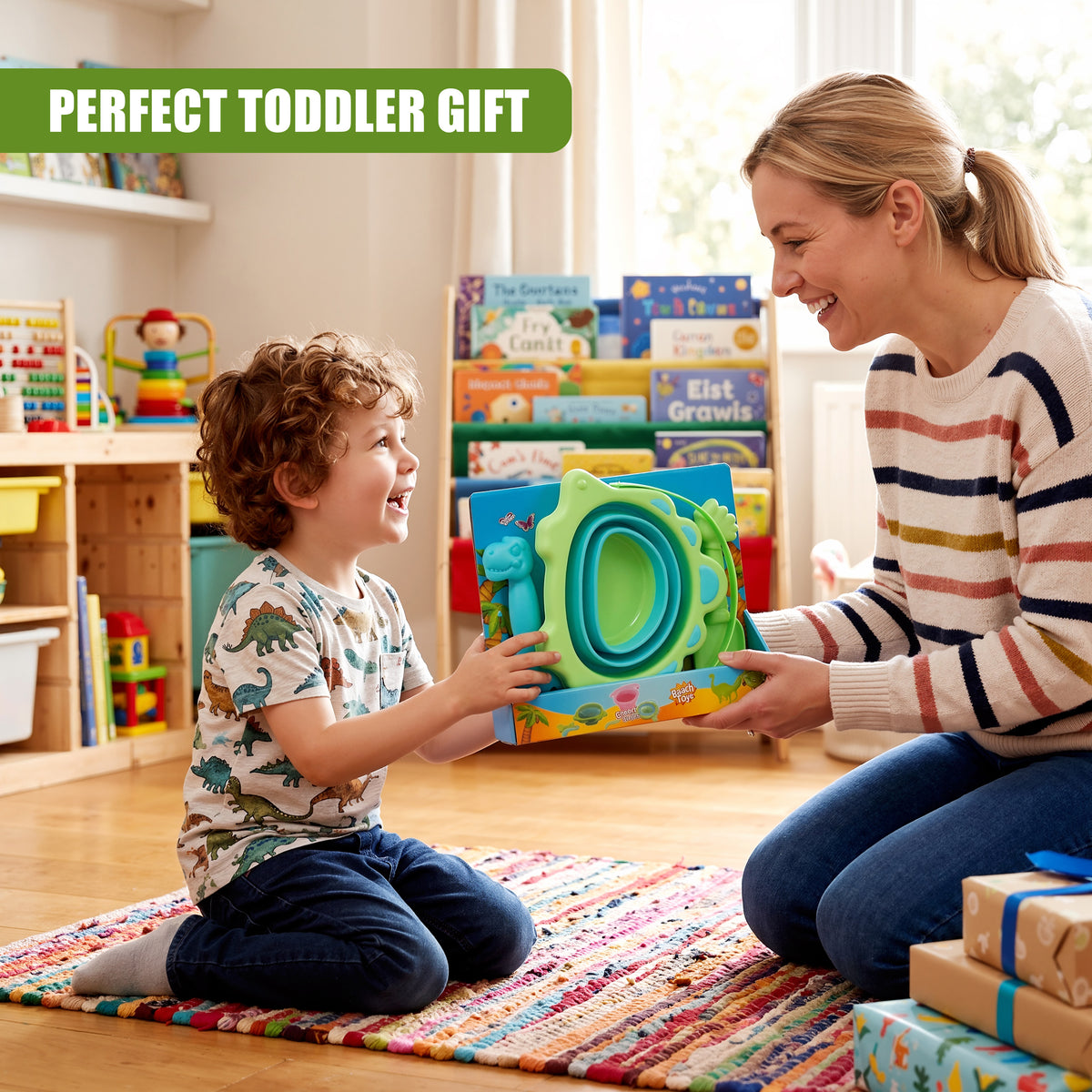 A young boy receives a collapsible beach bucket and spade set from his mother in a bright playroom