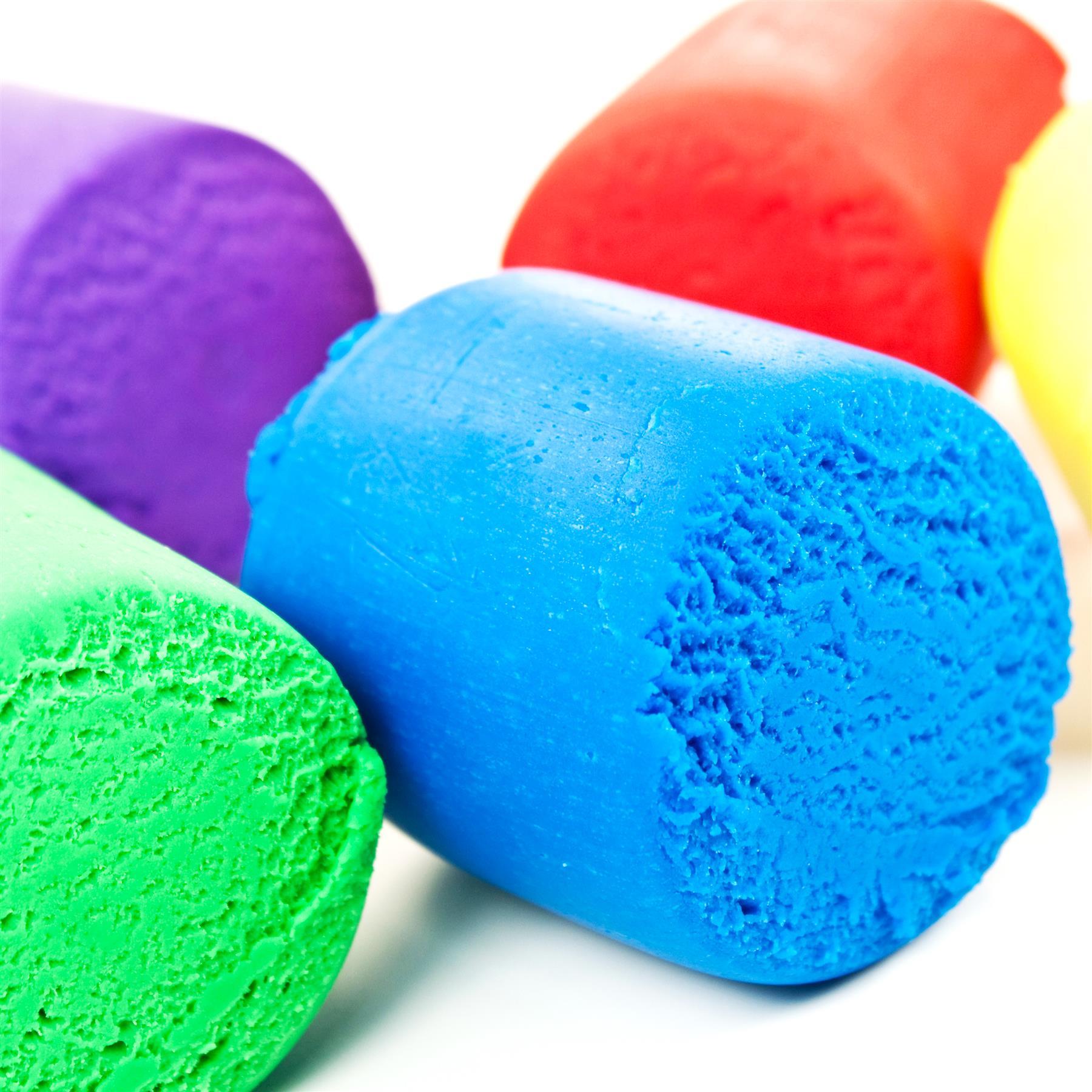 Four colorful play dough bars in a bucket.