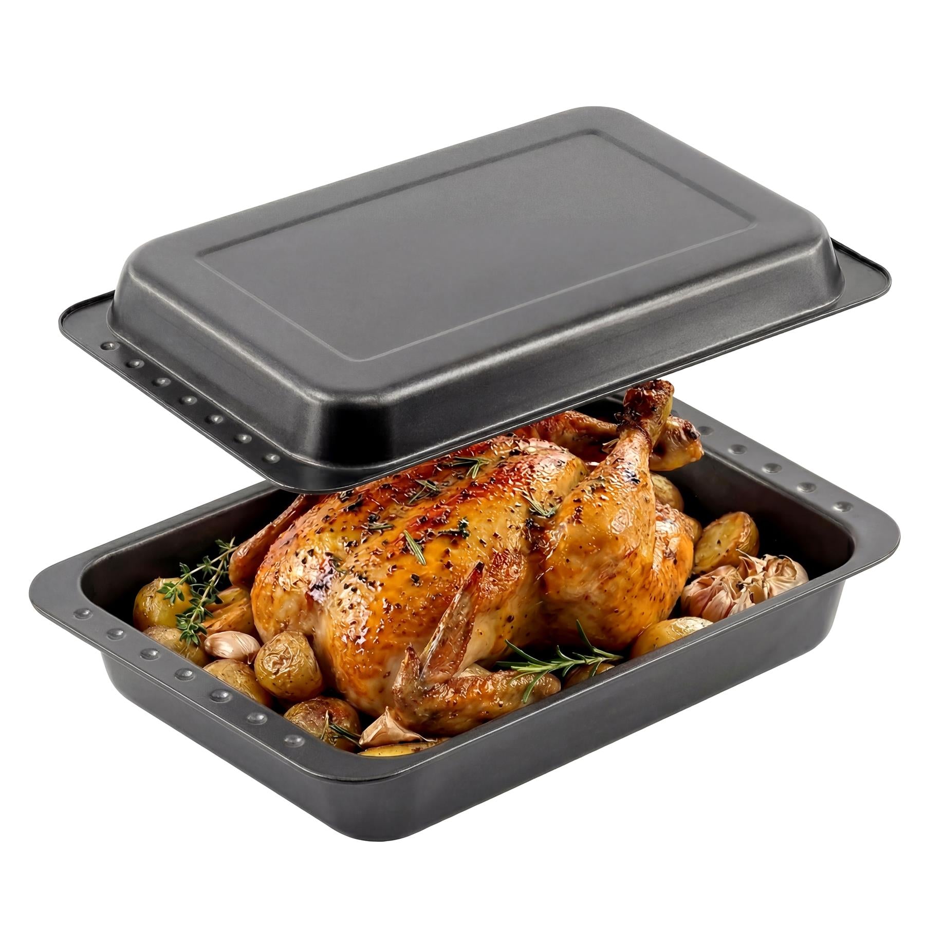 Deep roasting tin containing a whole roasted chicken, potatoes, and fresh herbs.