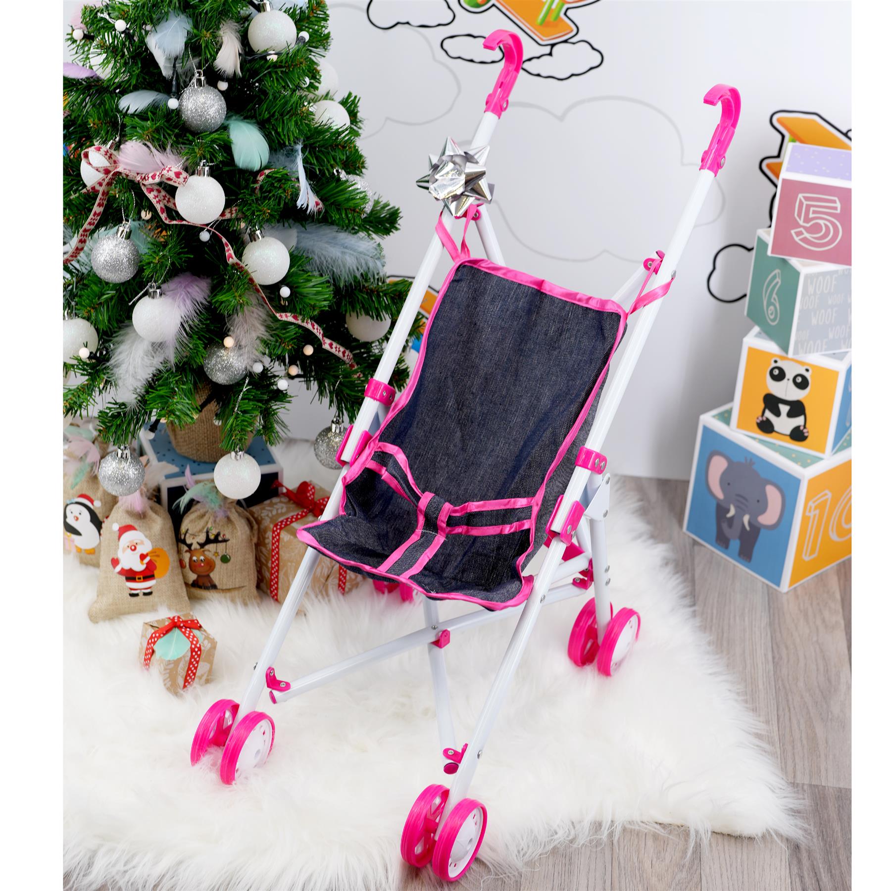 This is a photograph of a pink baby doll stroller with the brand name "BiBi" visible on its side. The stroller has a compact, foldable design and appears to be intended for play or as a toy accessory. It is situated against a plain background.