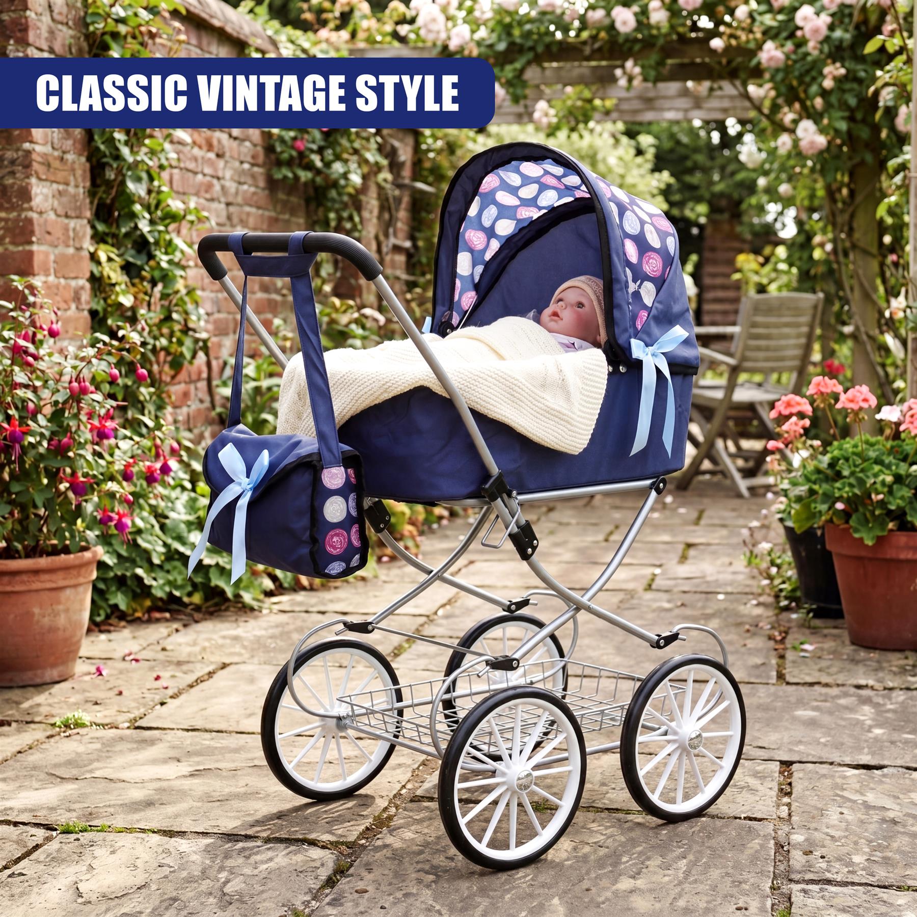Blue and white doll carriage pram featuring a canopy, attached bag, and four metal wheels.