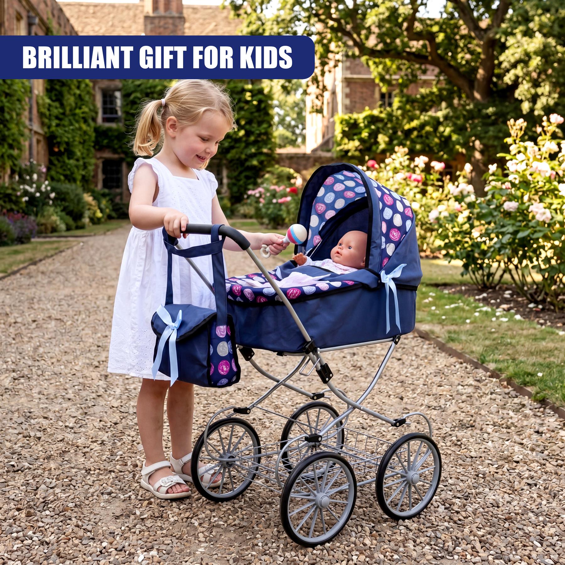 A blonde girl stands next to a blue baby pram decorated with a floral canopy pattern.