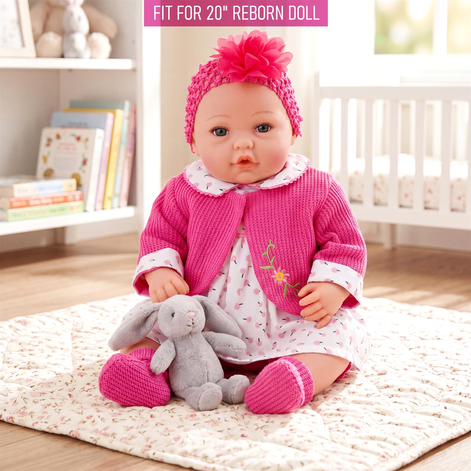Doll in hot pink outfit with pink headband, sitting with a stuffed gray bunny.