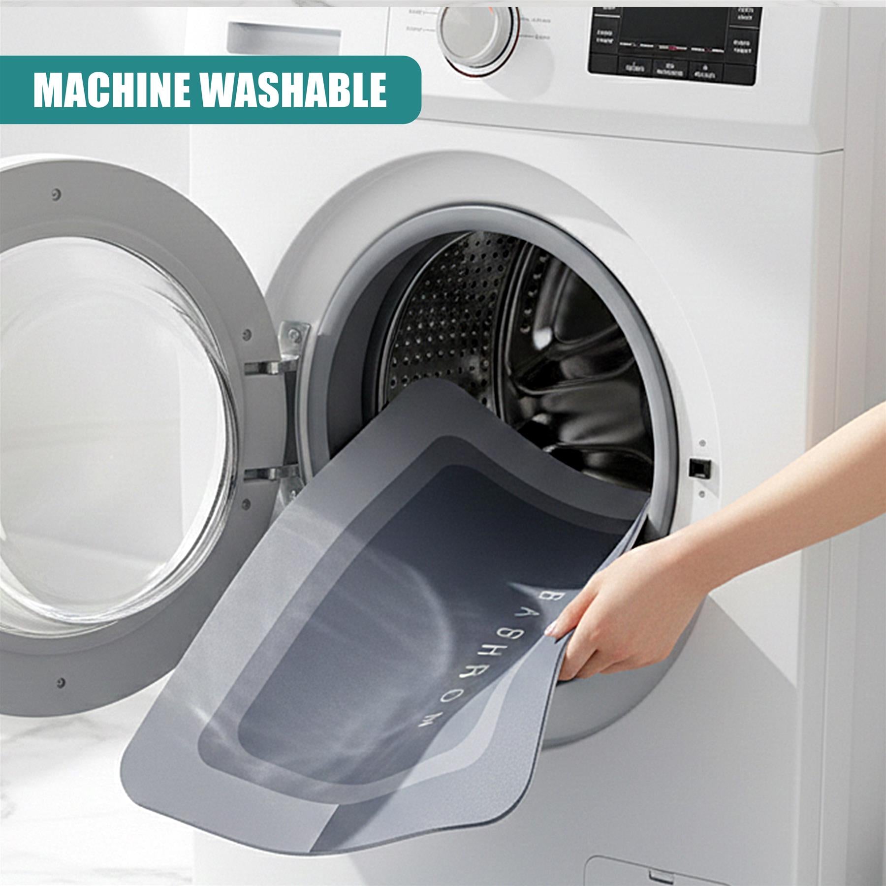 Dark grey anti-slip mat being placed into the drum of a white, front-loading washing machine.