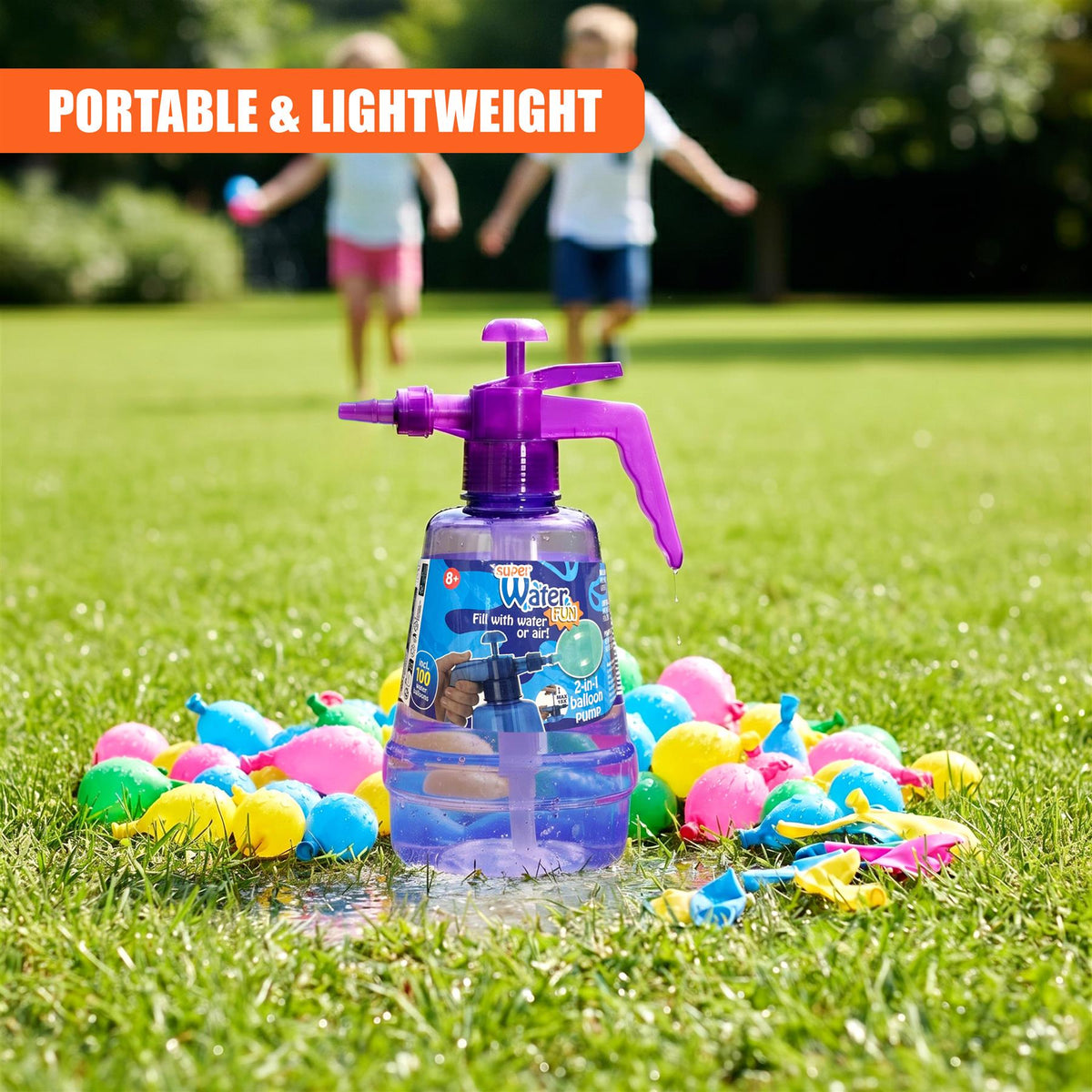 A purple water balloon pump bottle with 100 balloons sits on green grass, with children playing in the background
