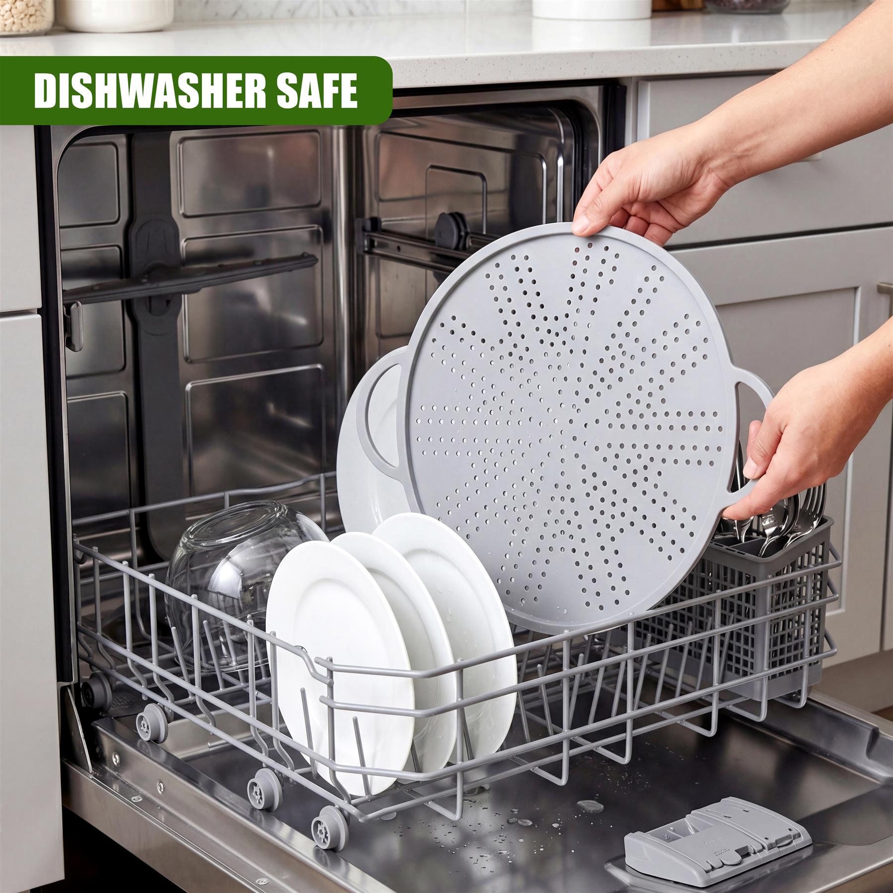 Hands place a large metal strainer among plates and cookware items in a clean dishwasher rack.