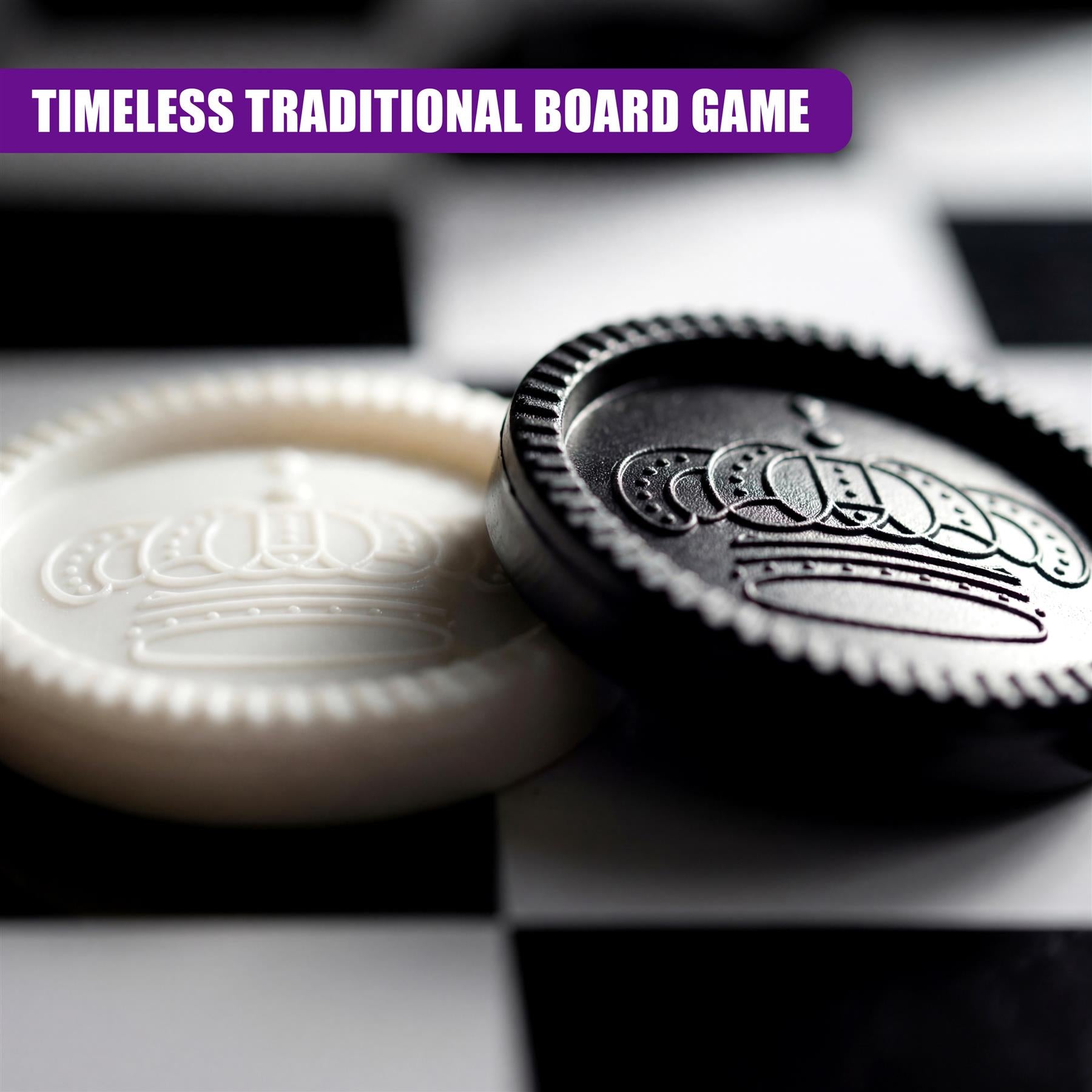 Two engraved game pieces featuring crowns rest on a black and white checkered playing board.